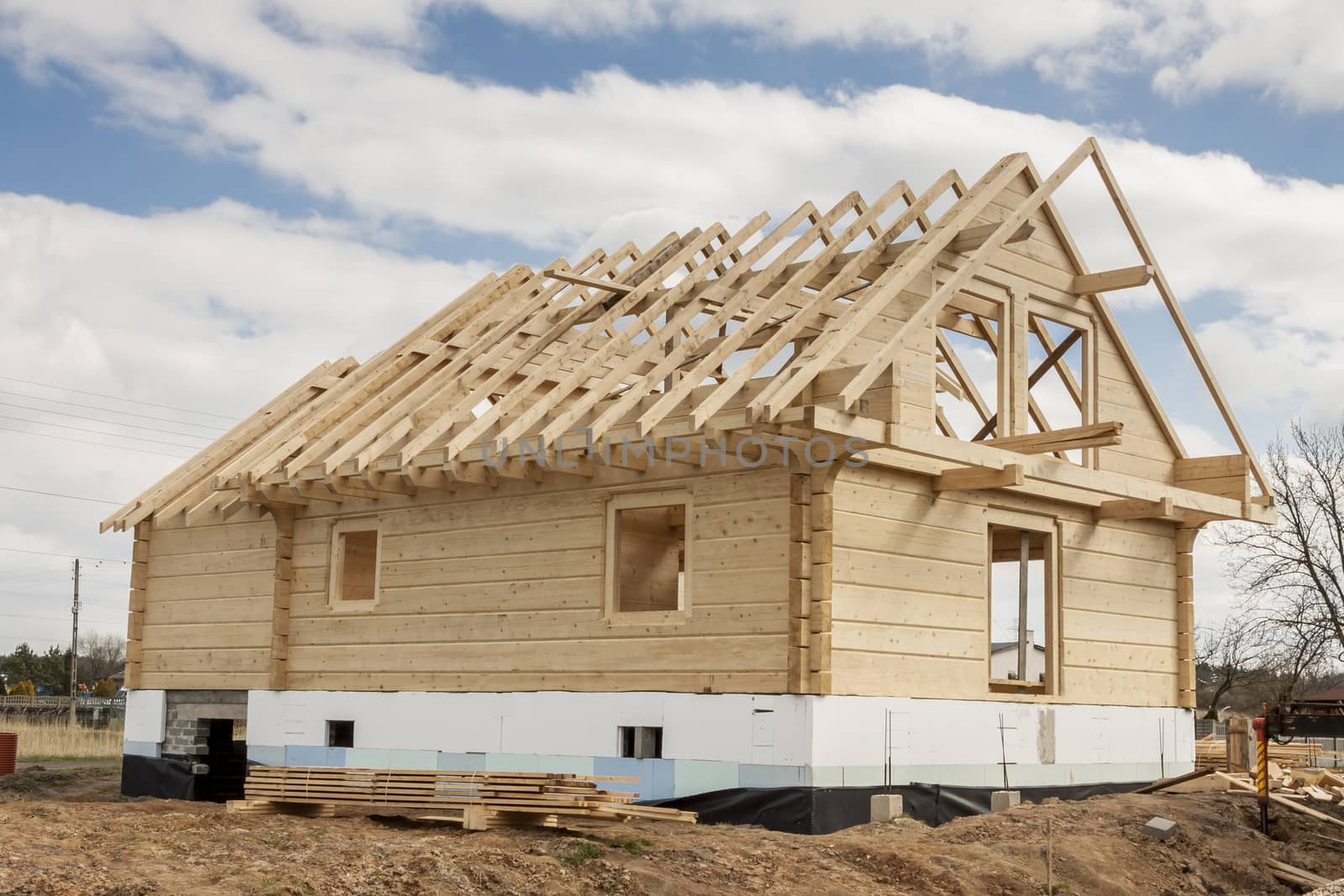 Wooden house under construction. Poland.