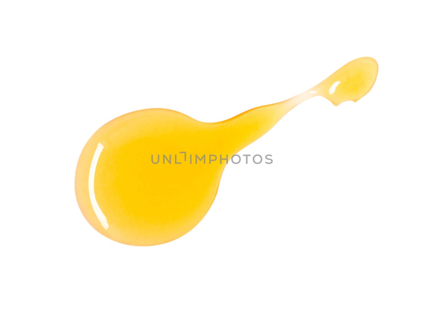 Closeup top view sweet honey drop isolated on white background with clipping path