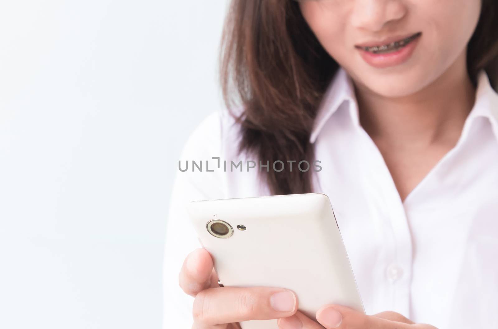 Closeup of business woman using smart phone, selective focus by pt.pongsak@gmail.com