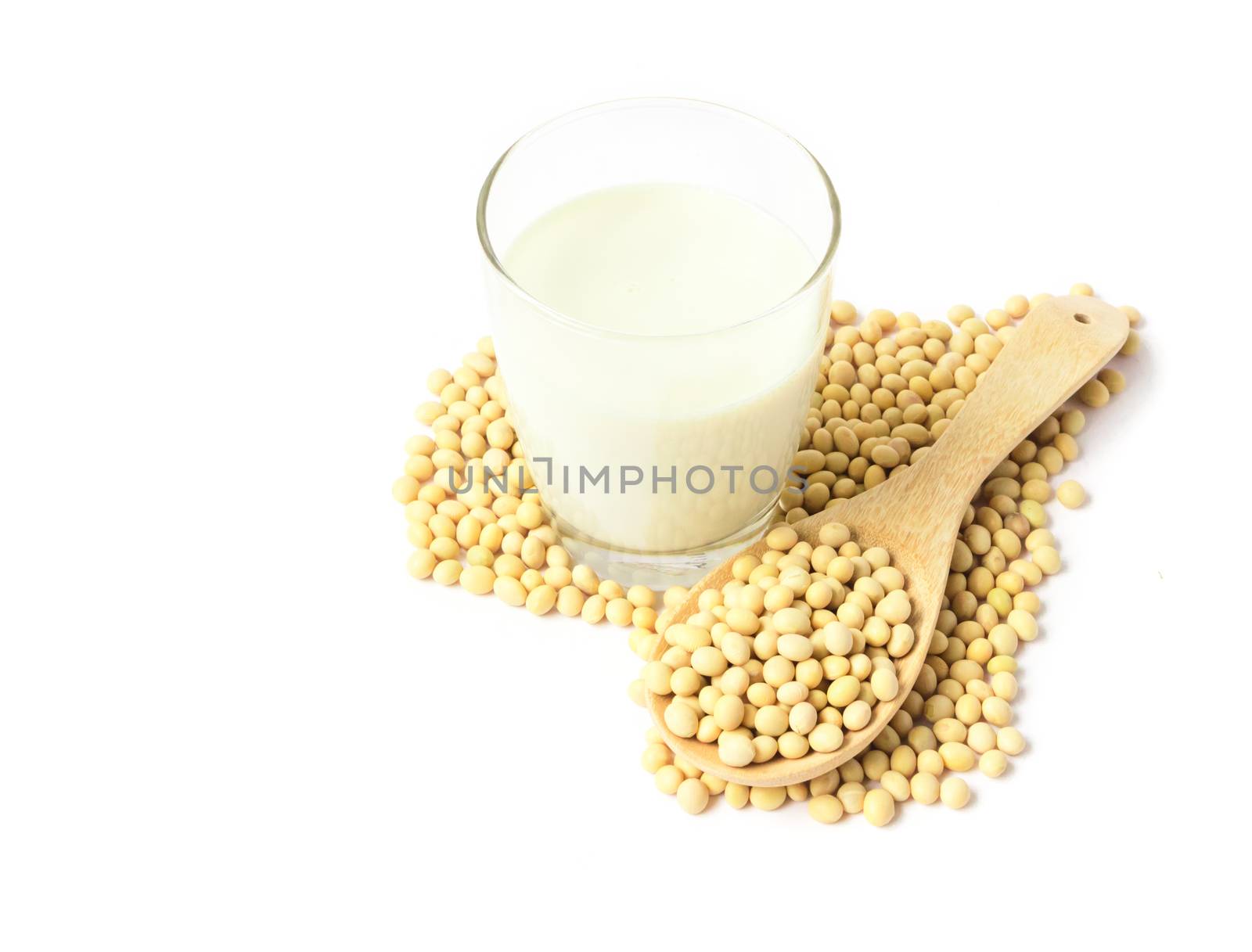 Glass soy milk and soy beans with heart shape on white background, food and drink healthy concept