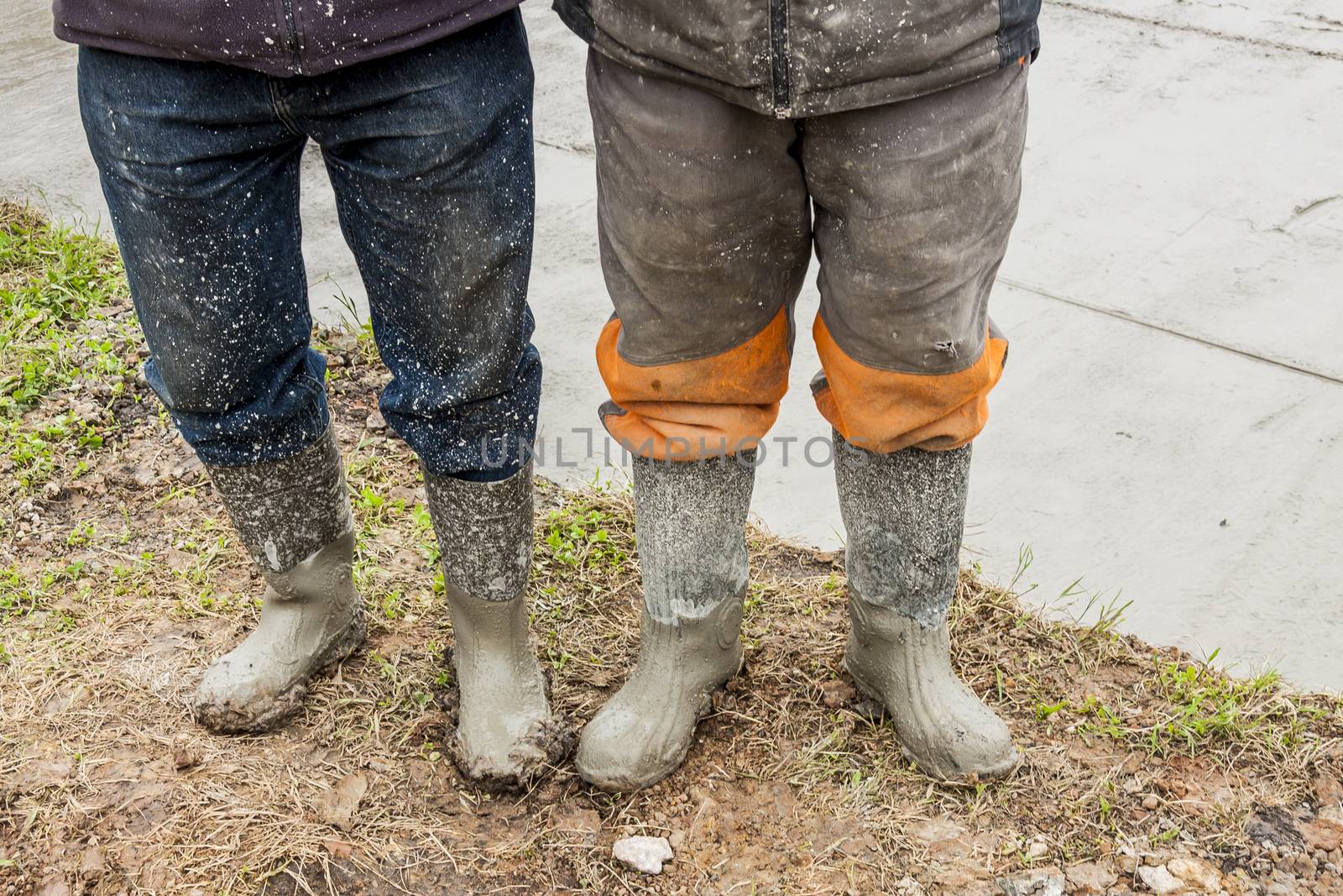 Two workers in wellingtons. by parys