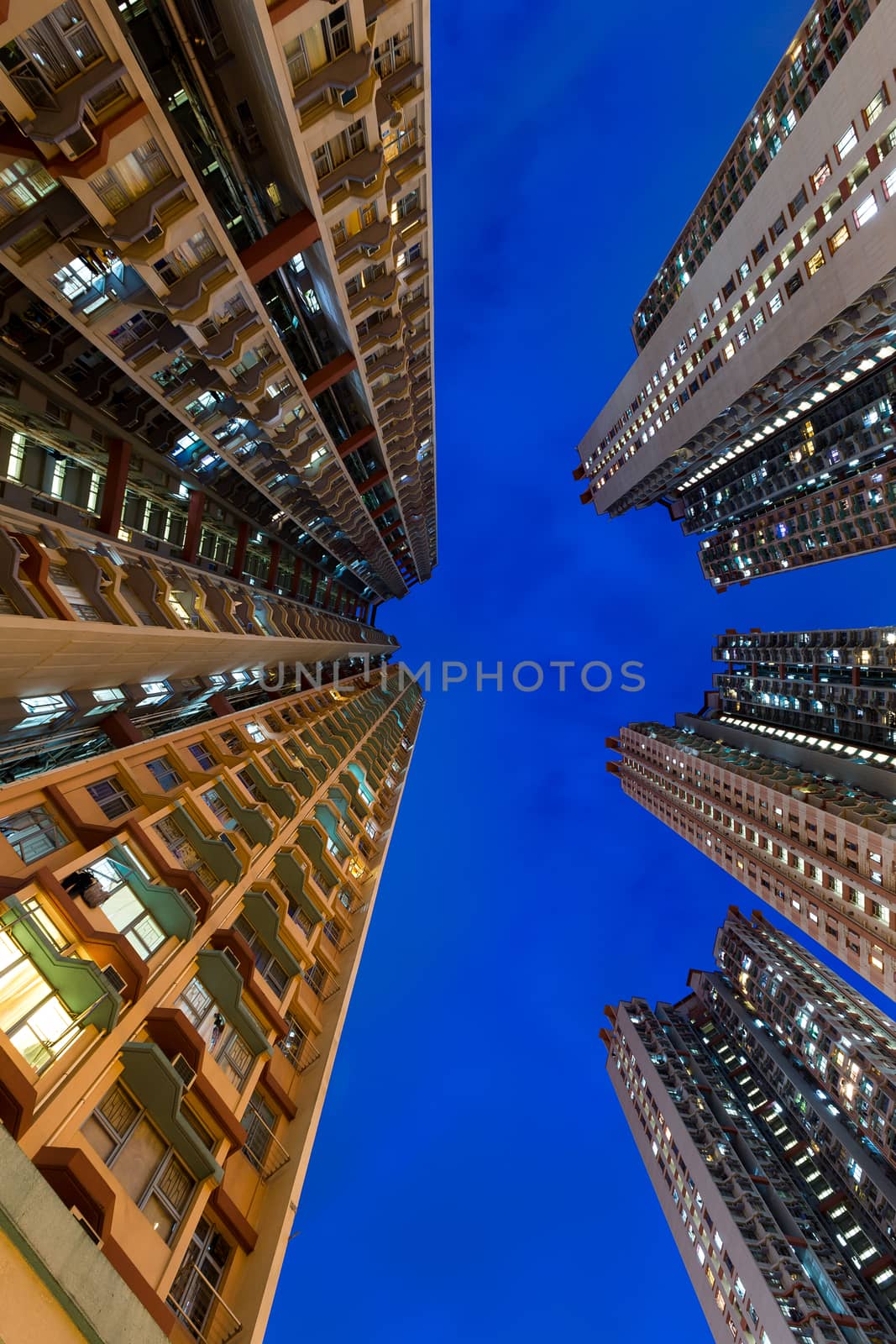 Apartment building at night by leungchopan