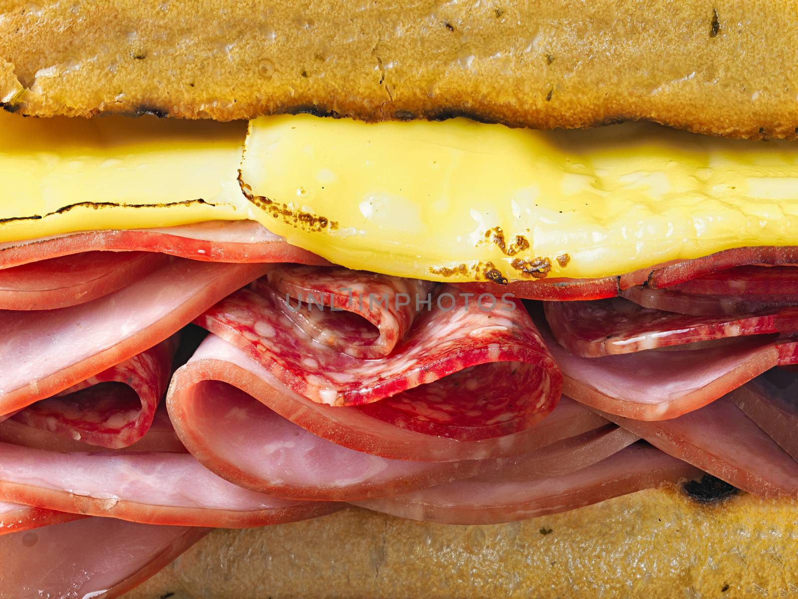 close up of rustic deli cold cuts sandwich
