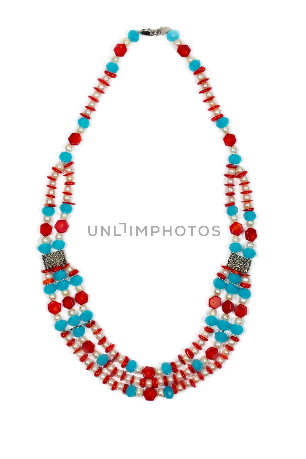 Necklace made of pearls and coral isolated on white background