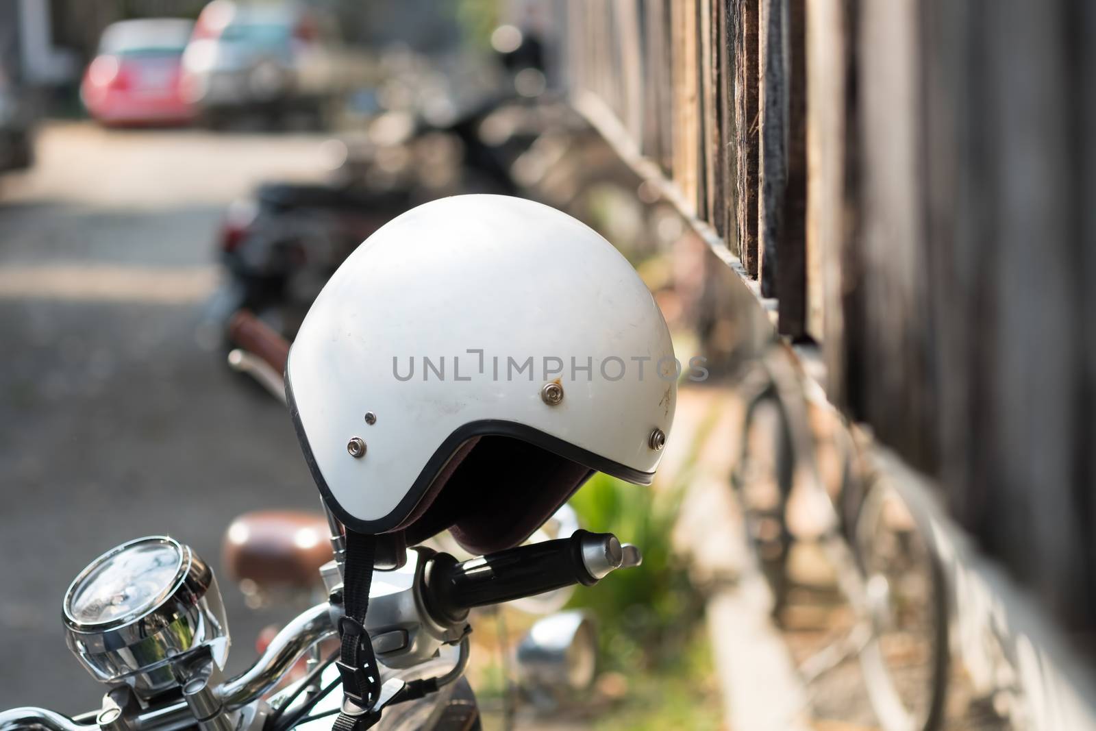 helmet on motorcycle with depth of field. by prathanchorruangsak