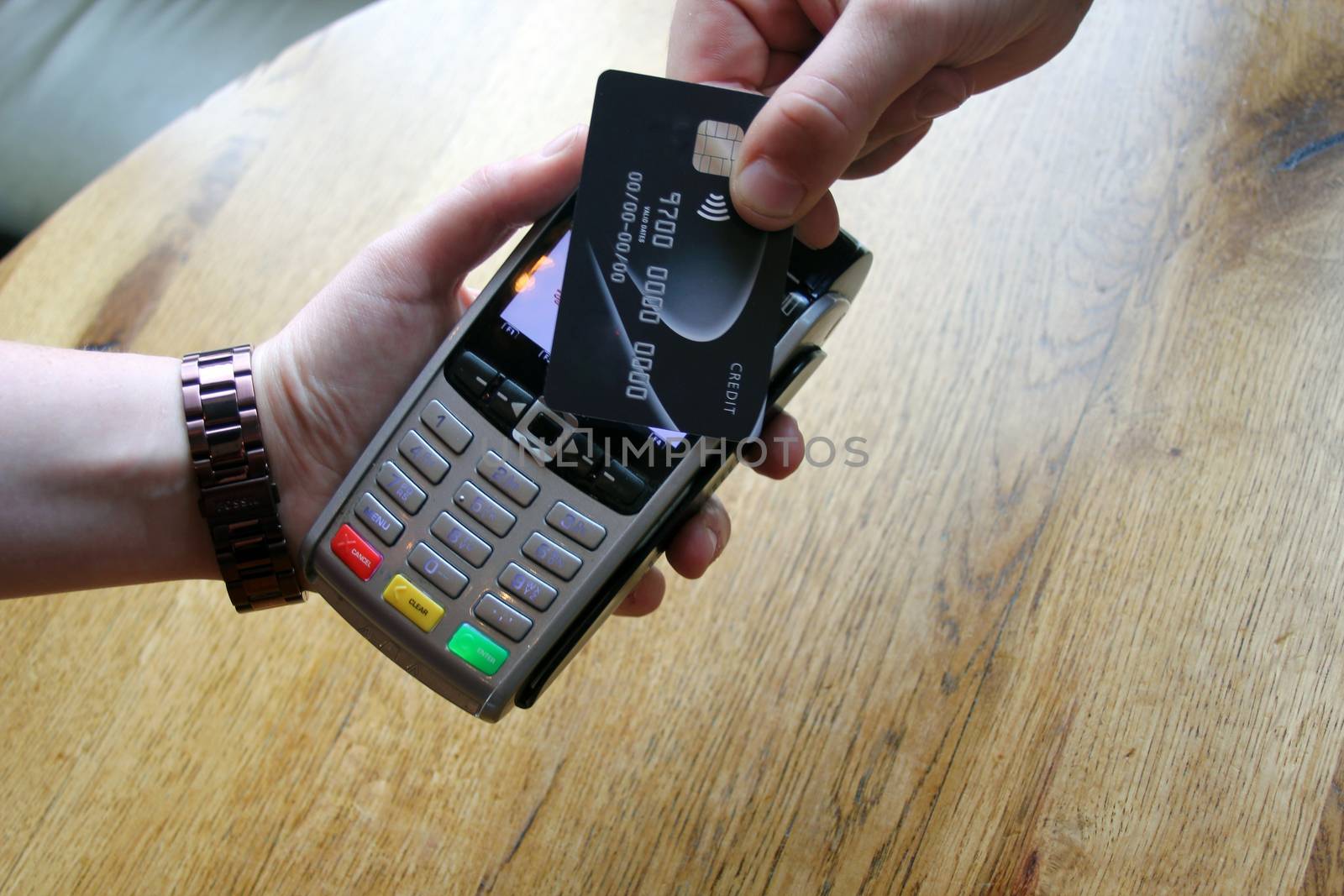 contactless payment card pdq background copy space with hand hol by cheekylorns
