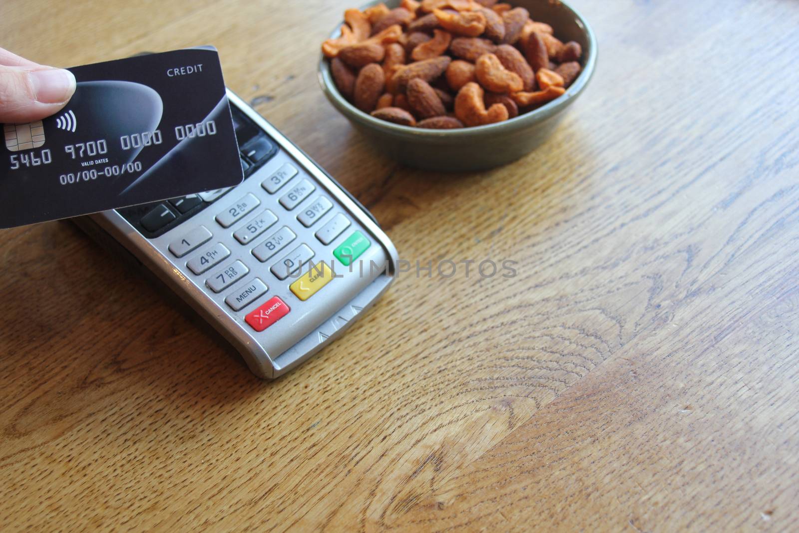 contactless payment card pdq background copy space with hand hol by cheekylorns