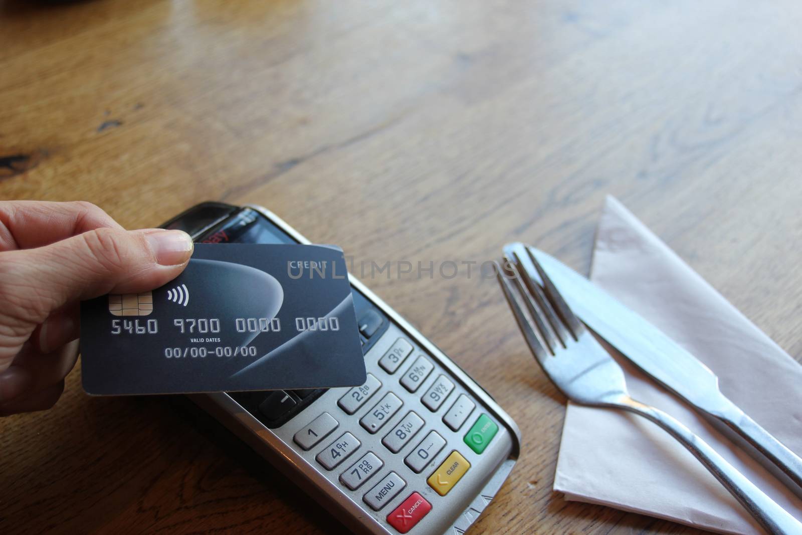 contactless payment card pdq background copy space with hand hol by cheekylorns