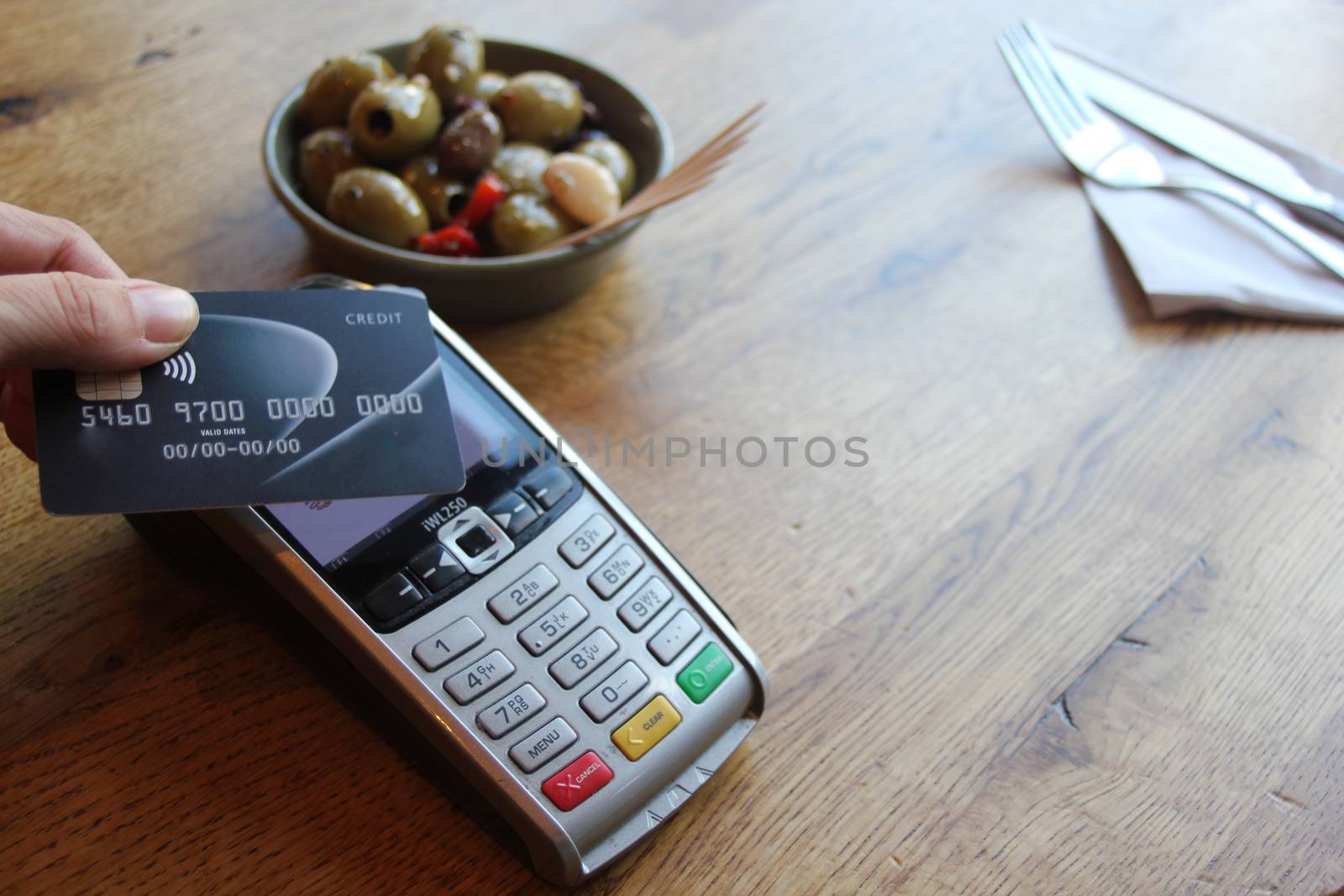 contactless payment card pdq background copy space with hand hol by cheekylorns