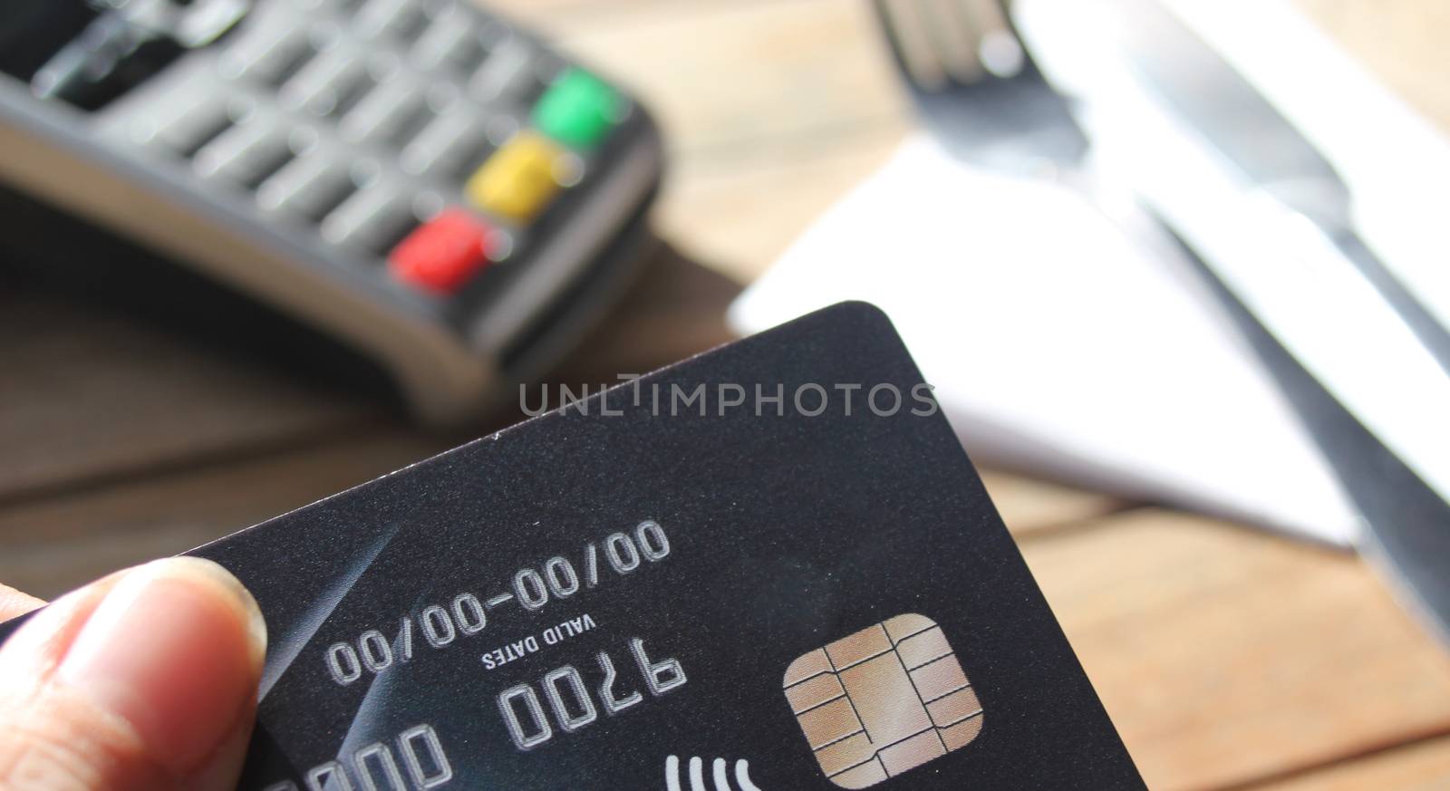 contactless payment card pdq background copy space with hand hol by cheekylorns