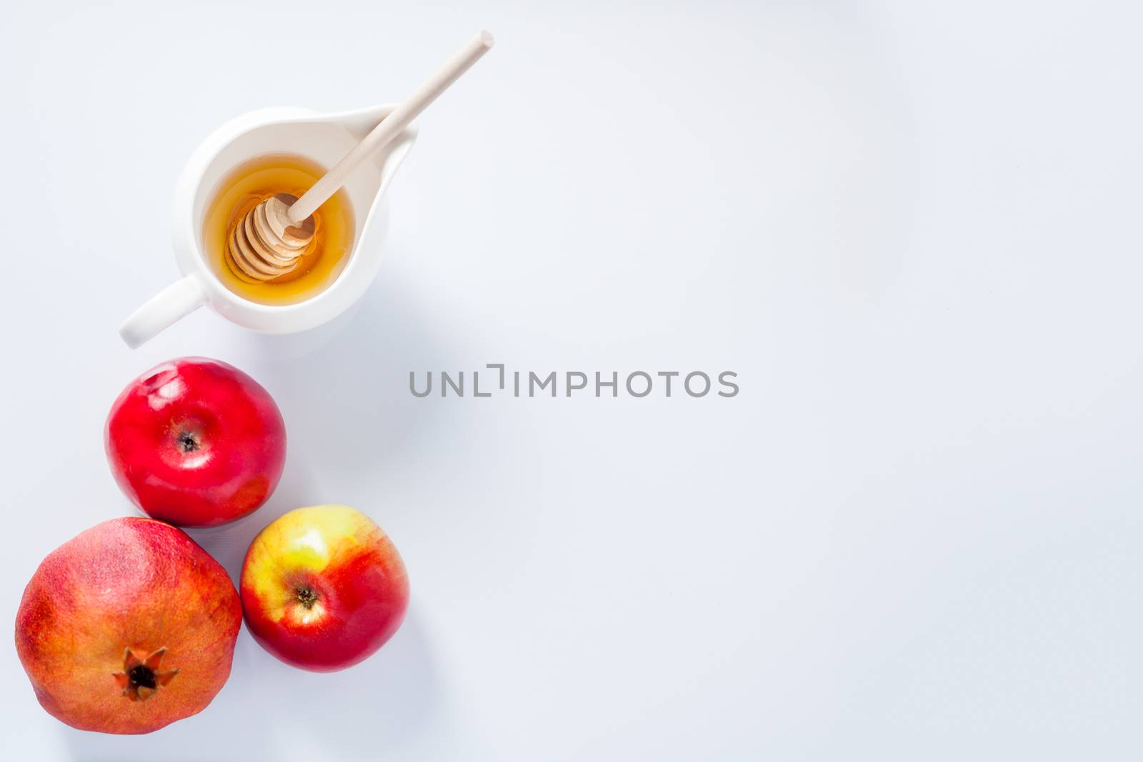 Apples, pomegranate and honey for Rosh Hashanah by supercat67