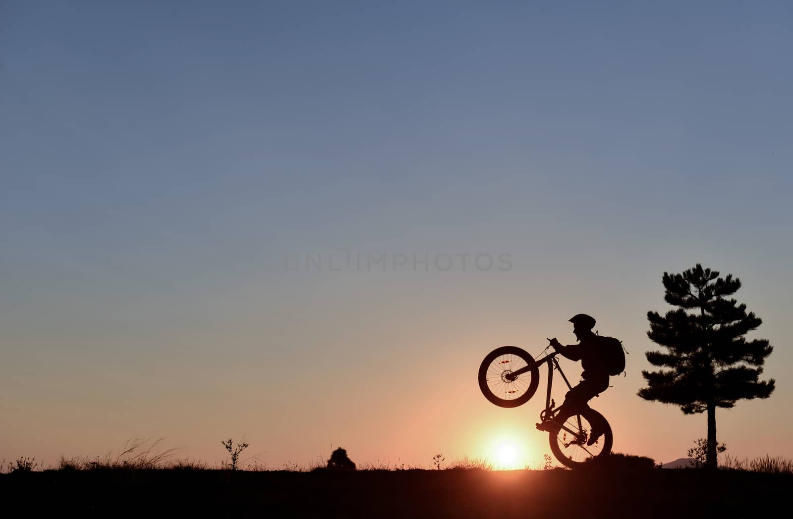 lone cyclist and sunrise peace by crazymedia007