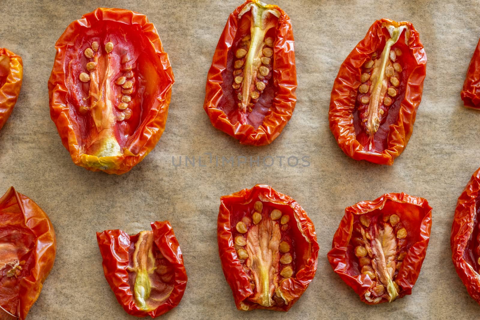 Dried sliced tomatoes on plate. Top view. close