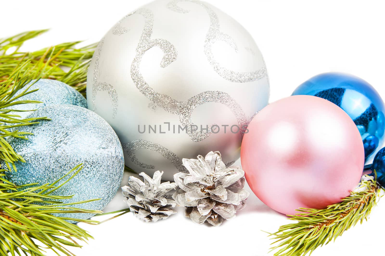 New year composition with fir tree, beautiful silver ball and silver cones close up