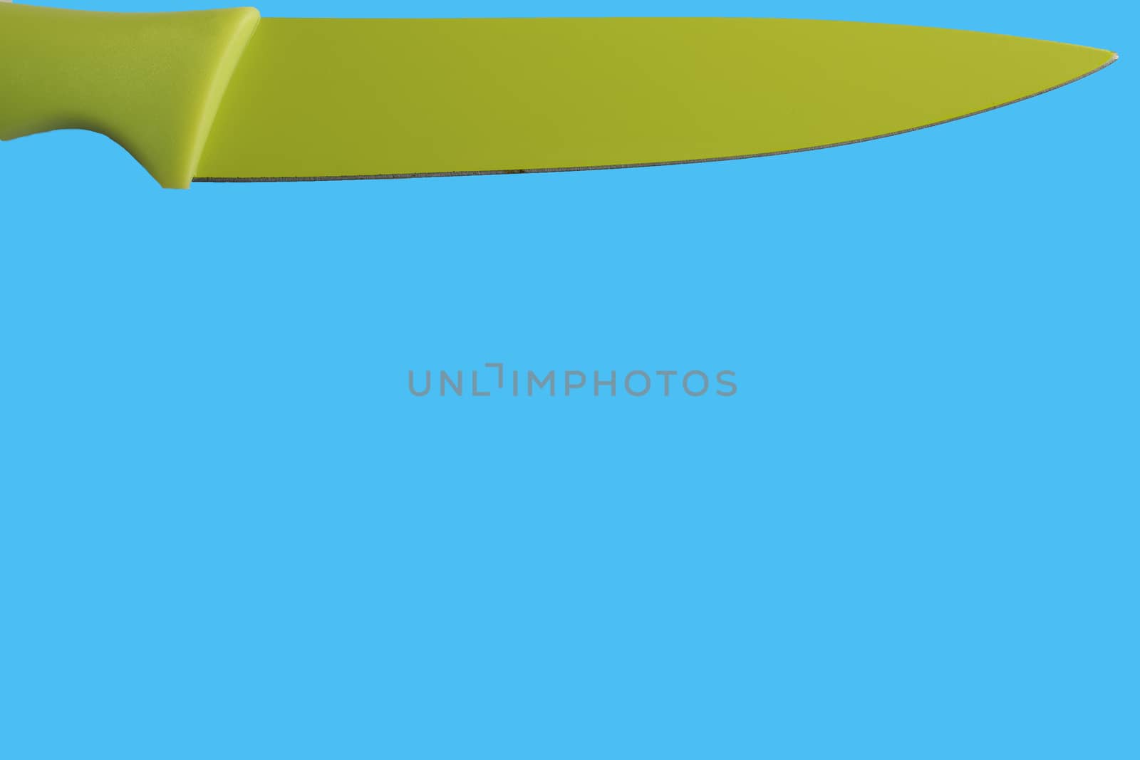 green isolated knife with blue background