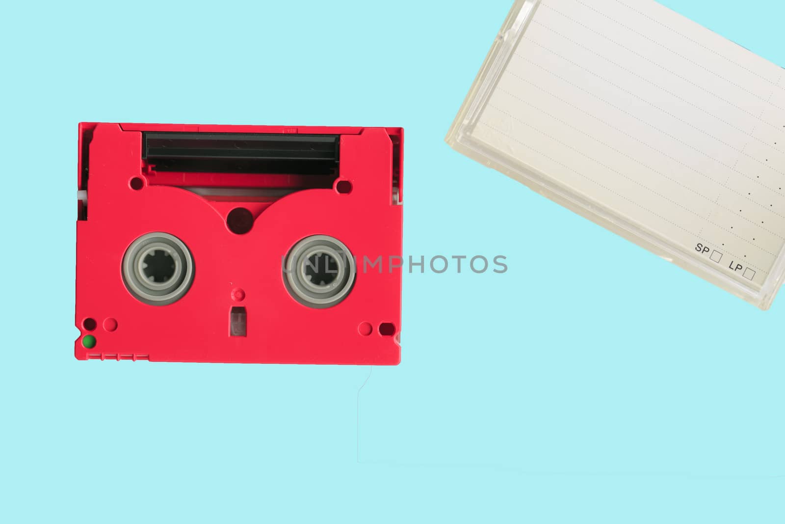 Red 8mm cassette with its box