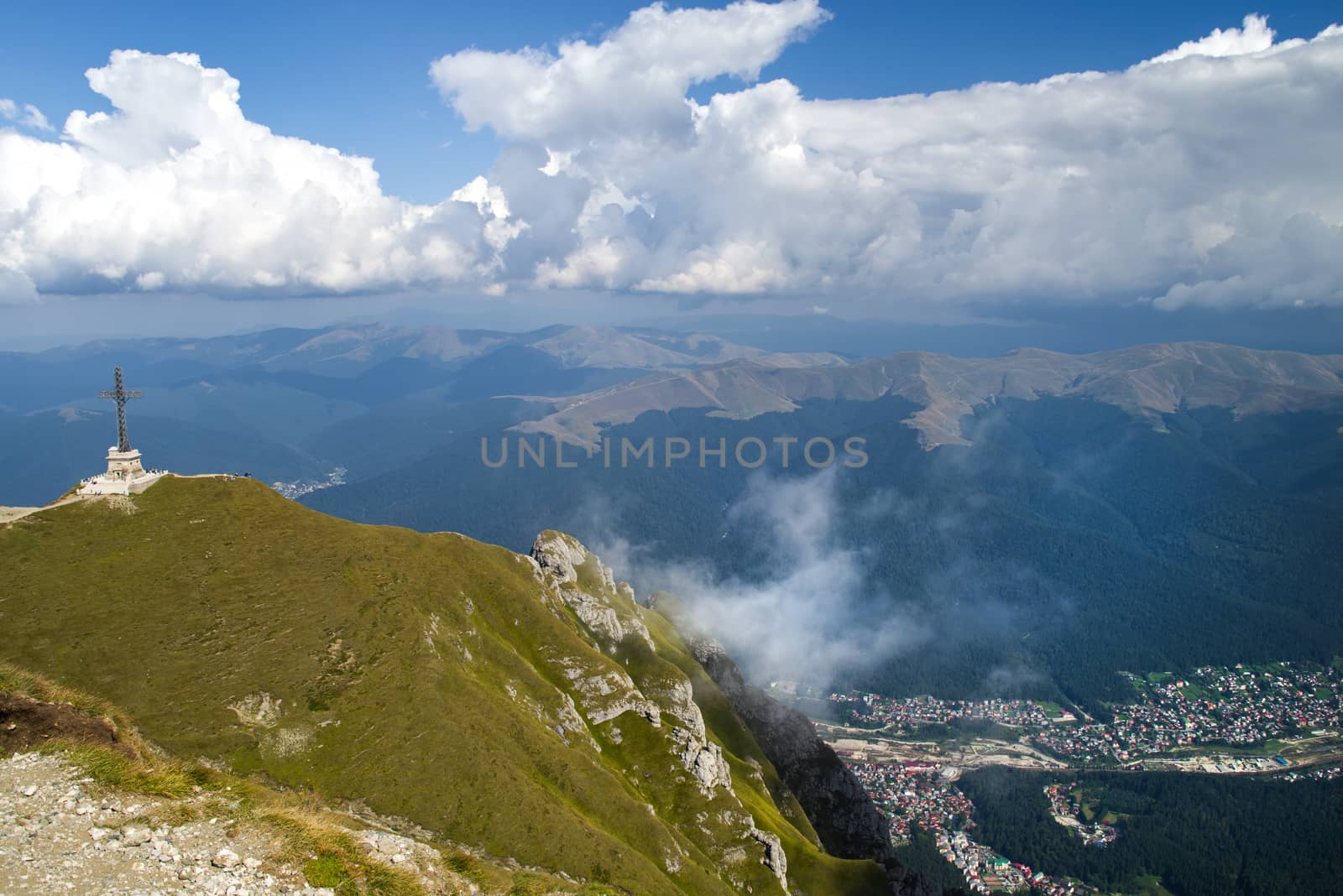 Aerial view of mountain resort from the top: Heroes Cross and Busteni resort in Bucegi Mountains, Romania