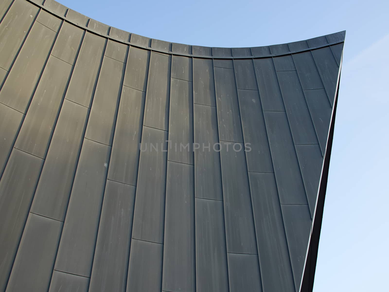 Modern abstract architecture in clear straight lines blue sky background      