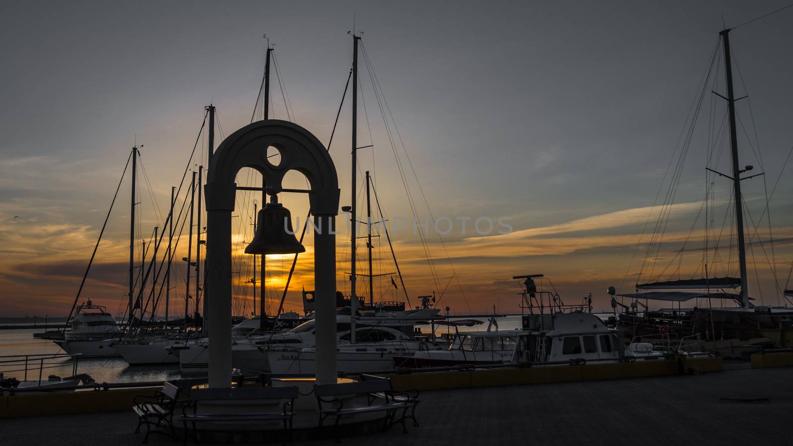 Big bell on the quay in the seaport