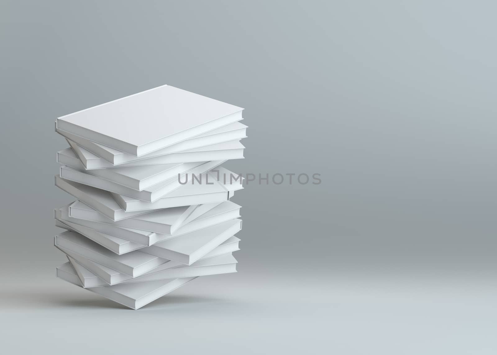 Stack of white empty books on gray background by cherezoff