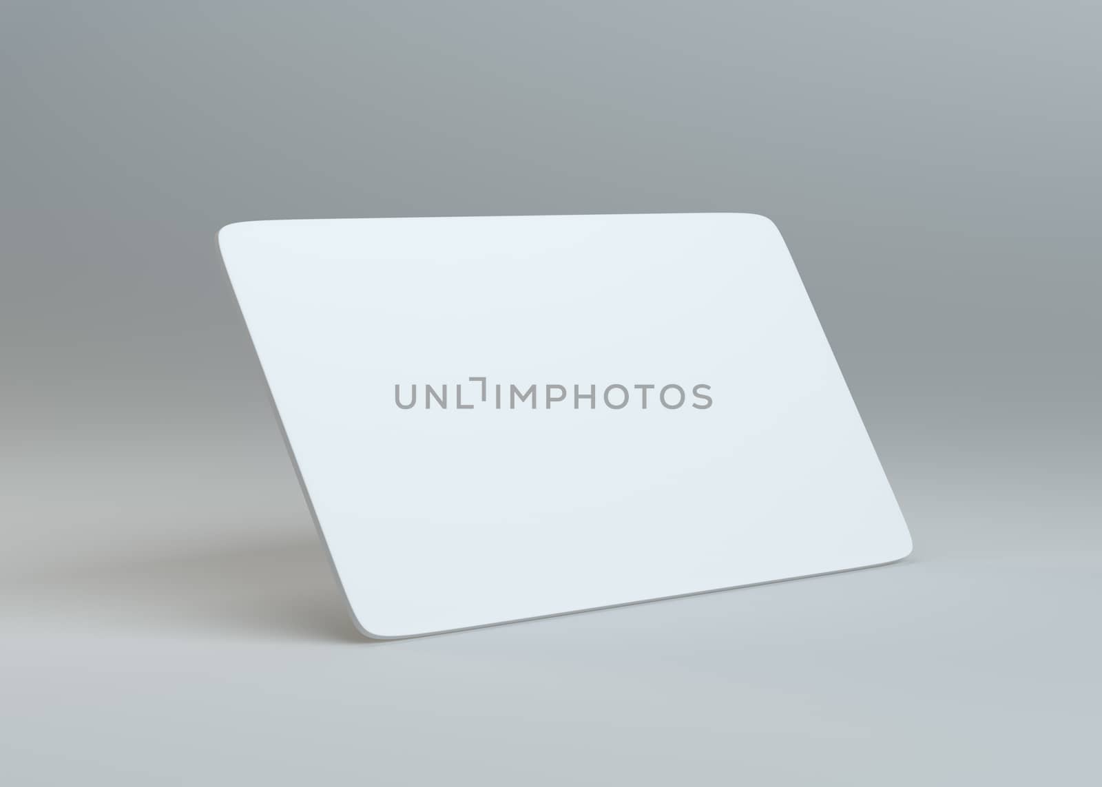 White empty paper card on gray background by cherezoff