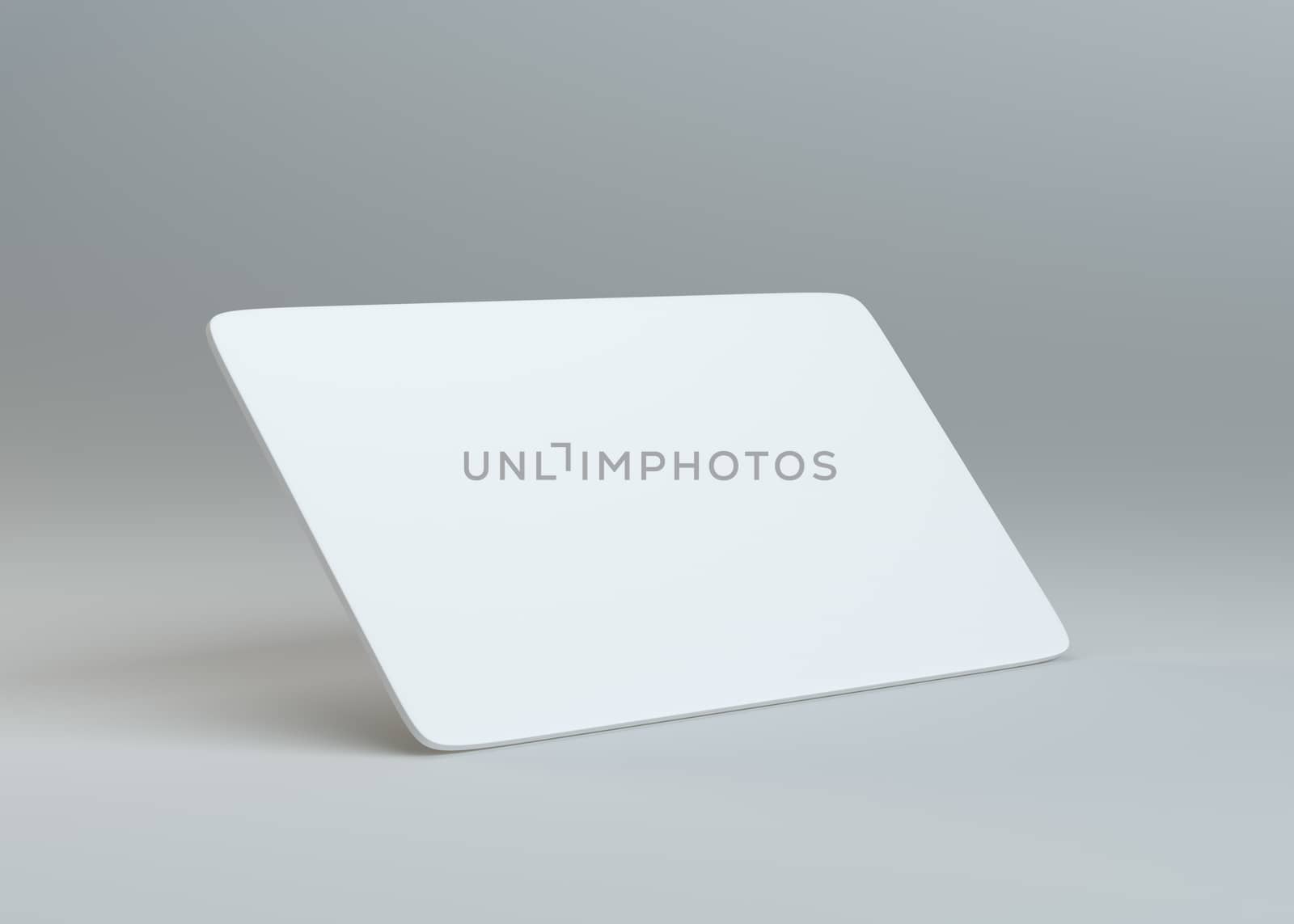 White empty paper card on gray background by cherezoff