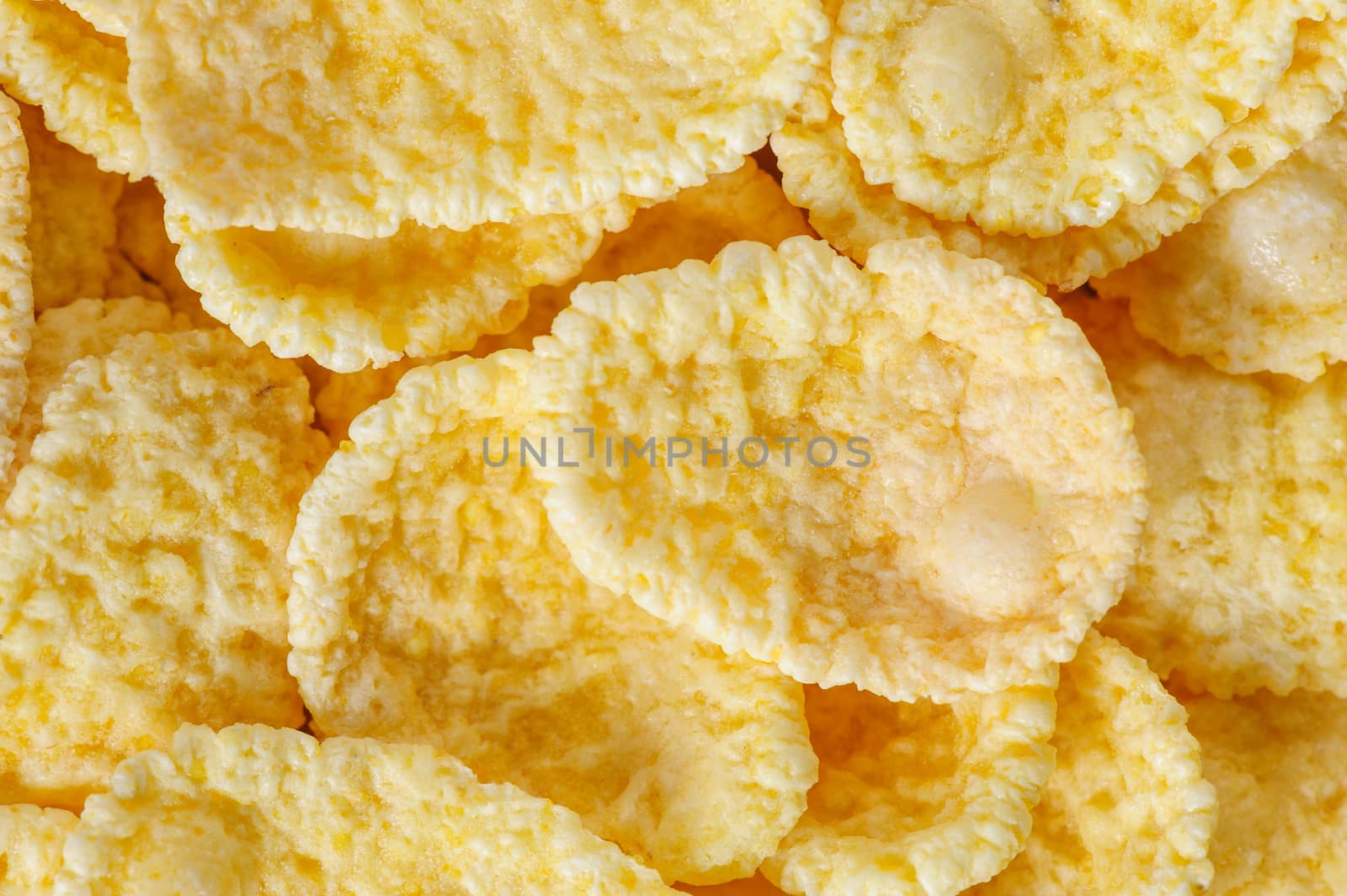 small heap of cornflakes, extreme closeup, macro, suitable as background