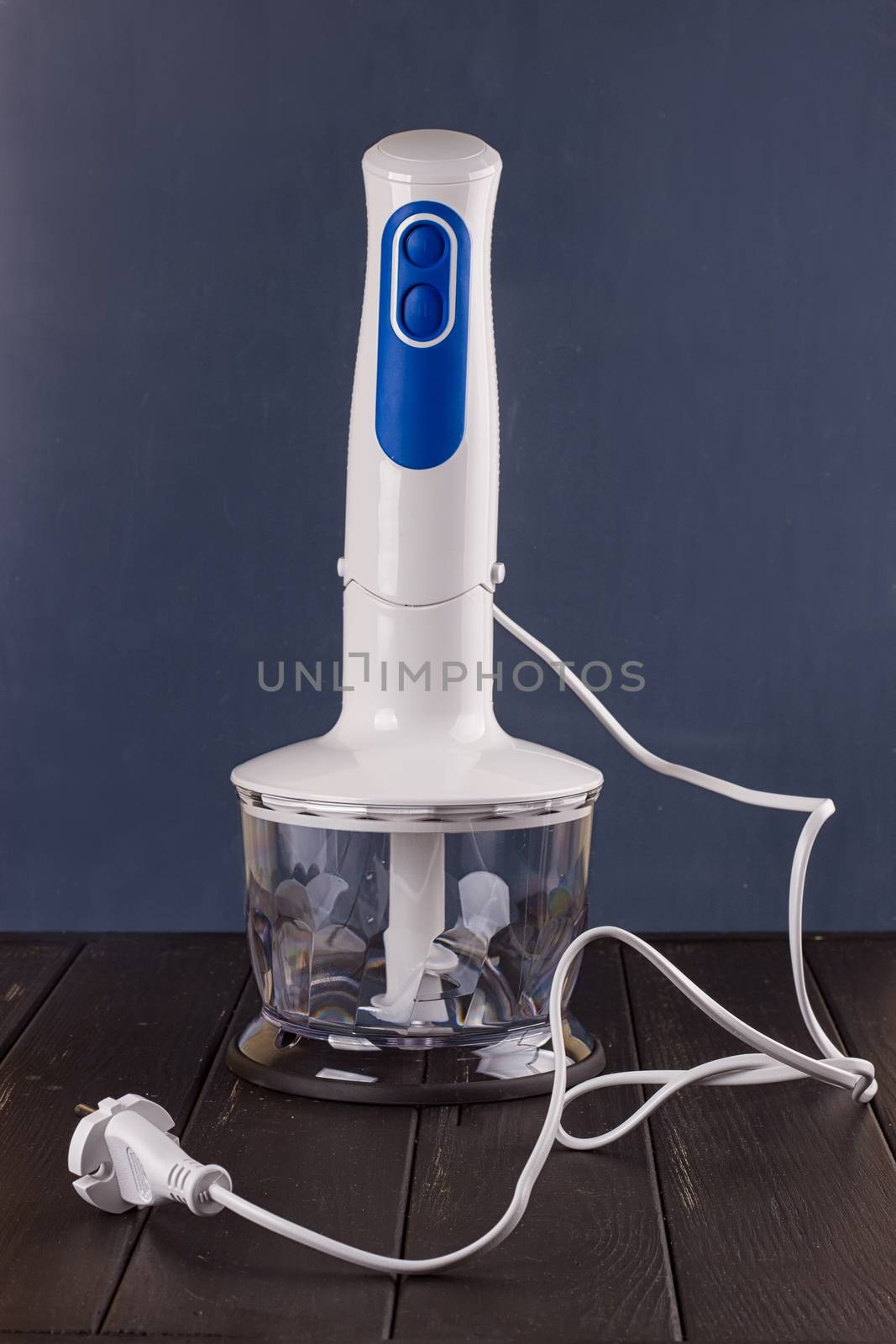 hand blender electric mixer on the black background
