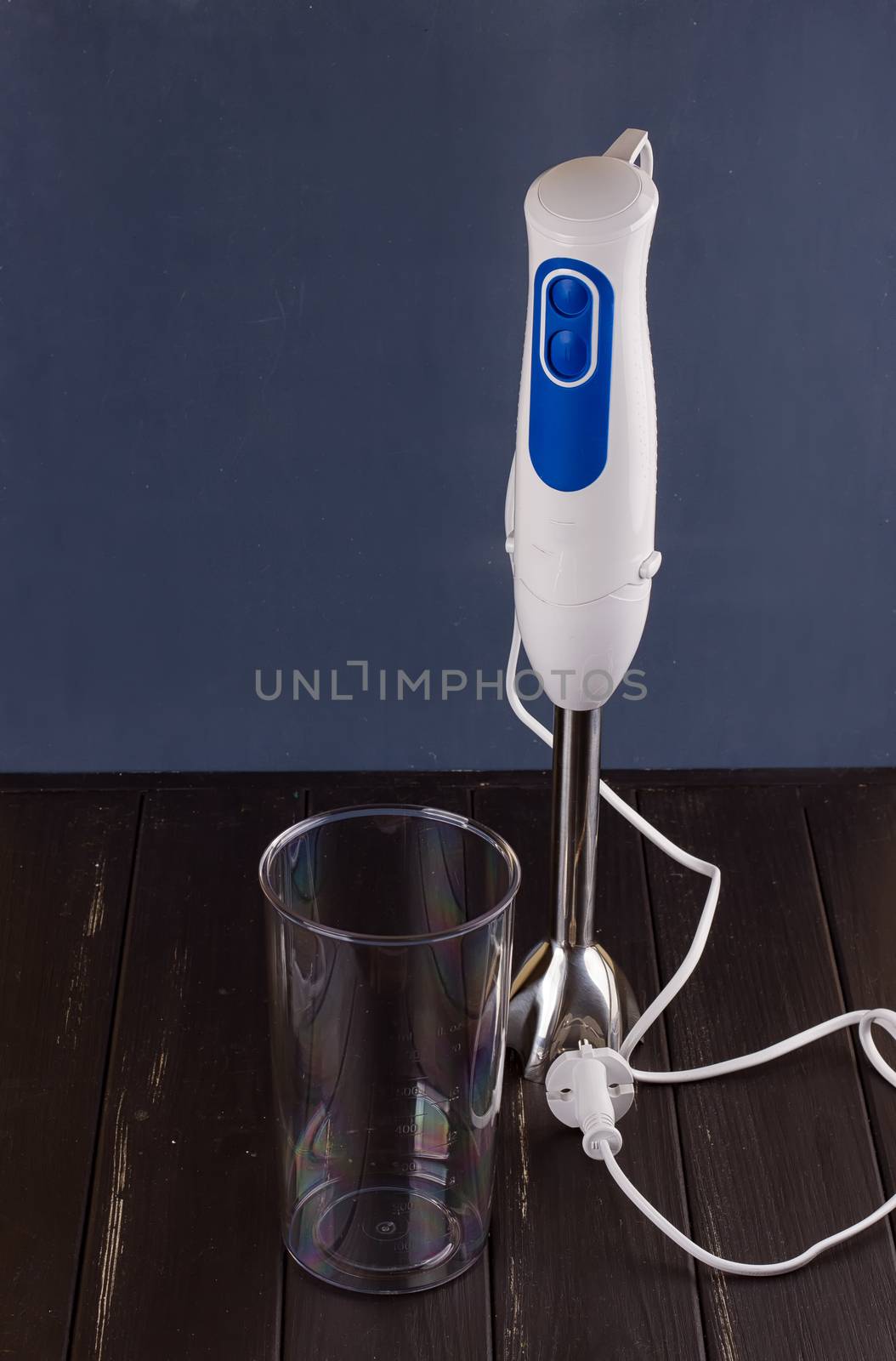 hand blender electric mixer on the black background