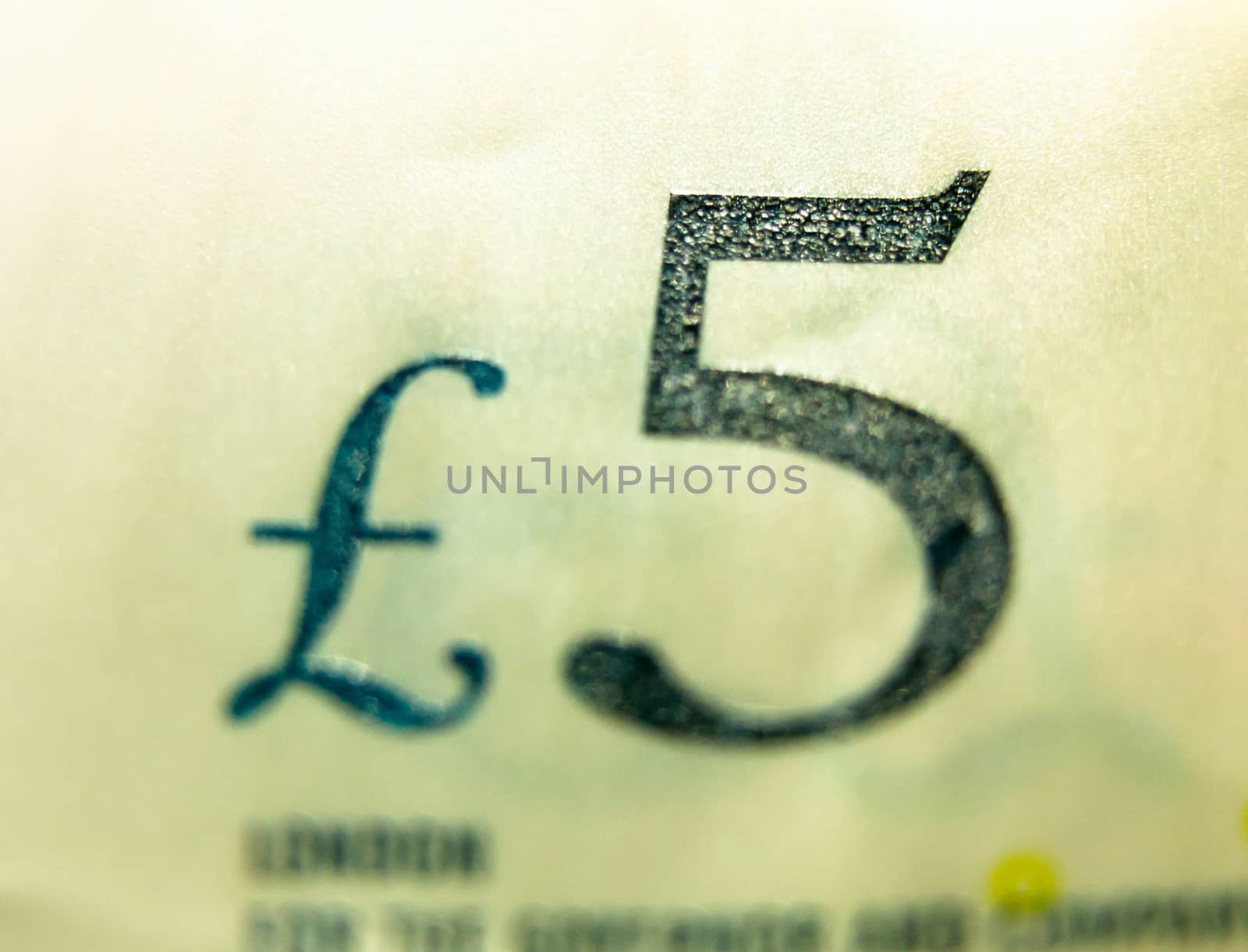 close up selective focus of five pound note £5; UK