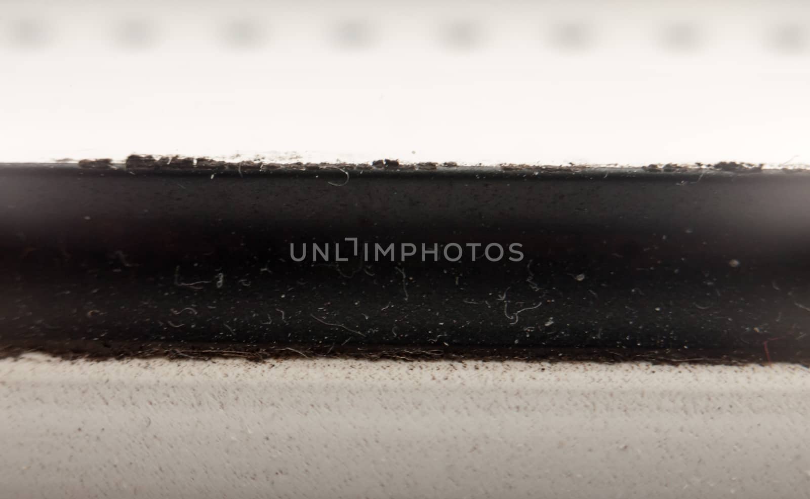 close up texture macro background of black strip through white background; UK
