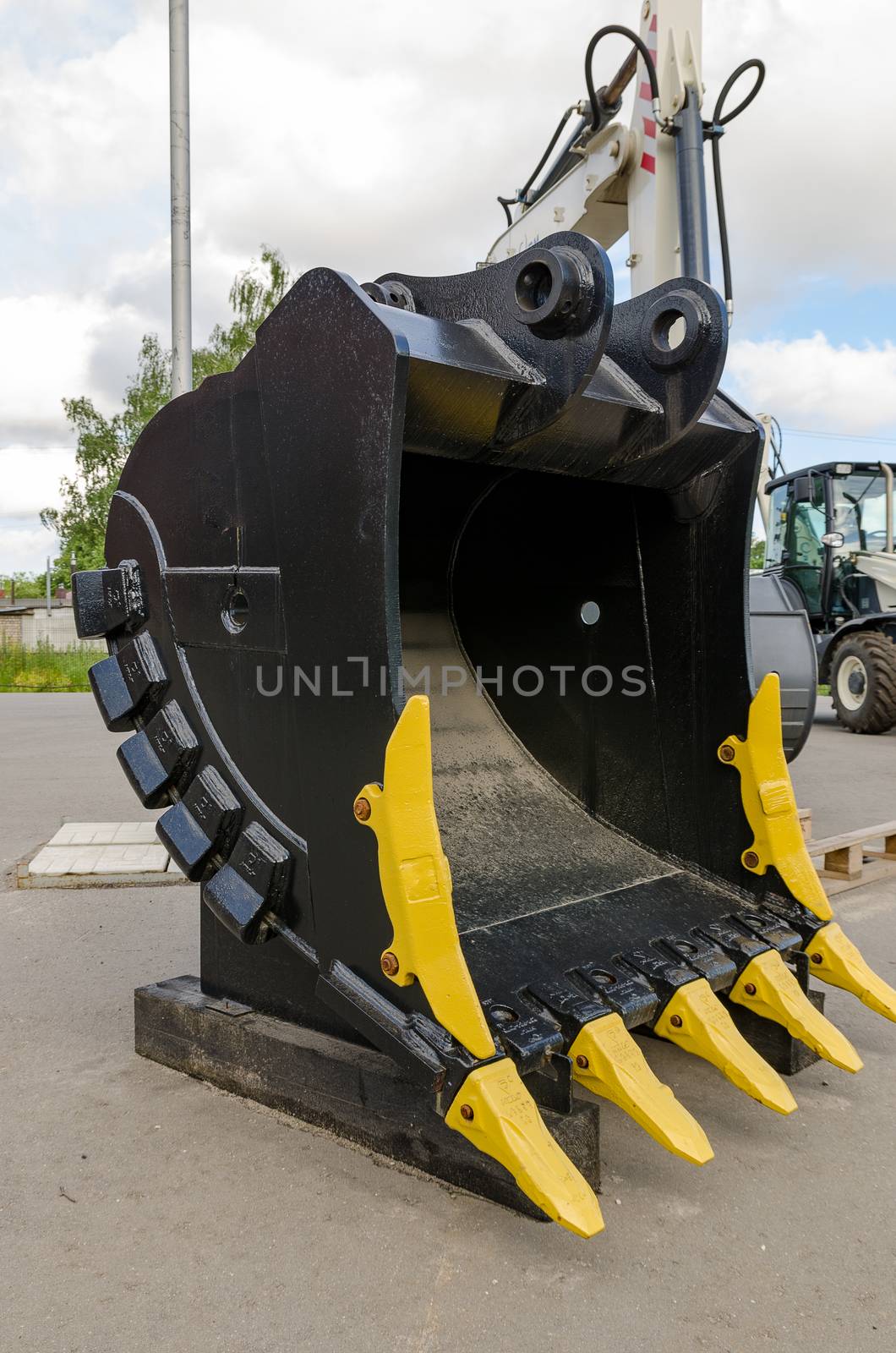 New road-construction equipment outdoors on the exhibition