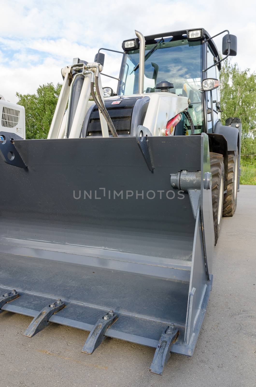New road-construction equipment outdoors on the exhibition