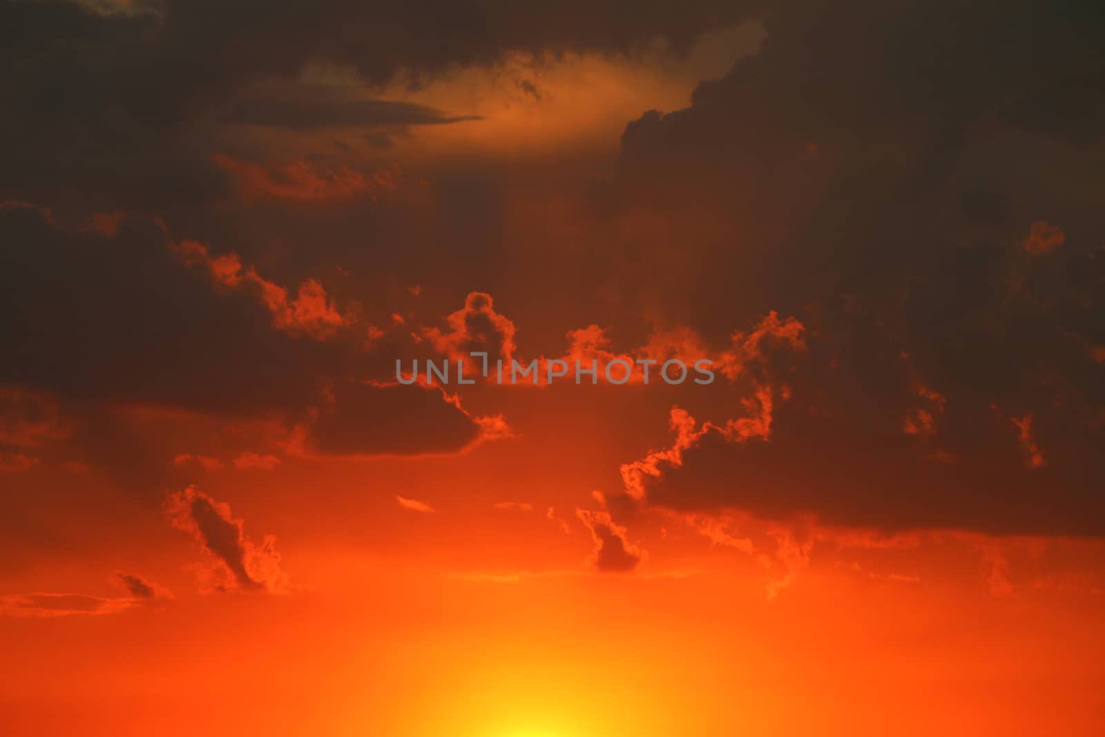 Thunderclouds at sunset. Gloomy dark gray clouds. Nature summer sunlight wallpaper