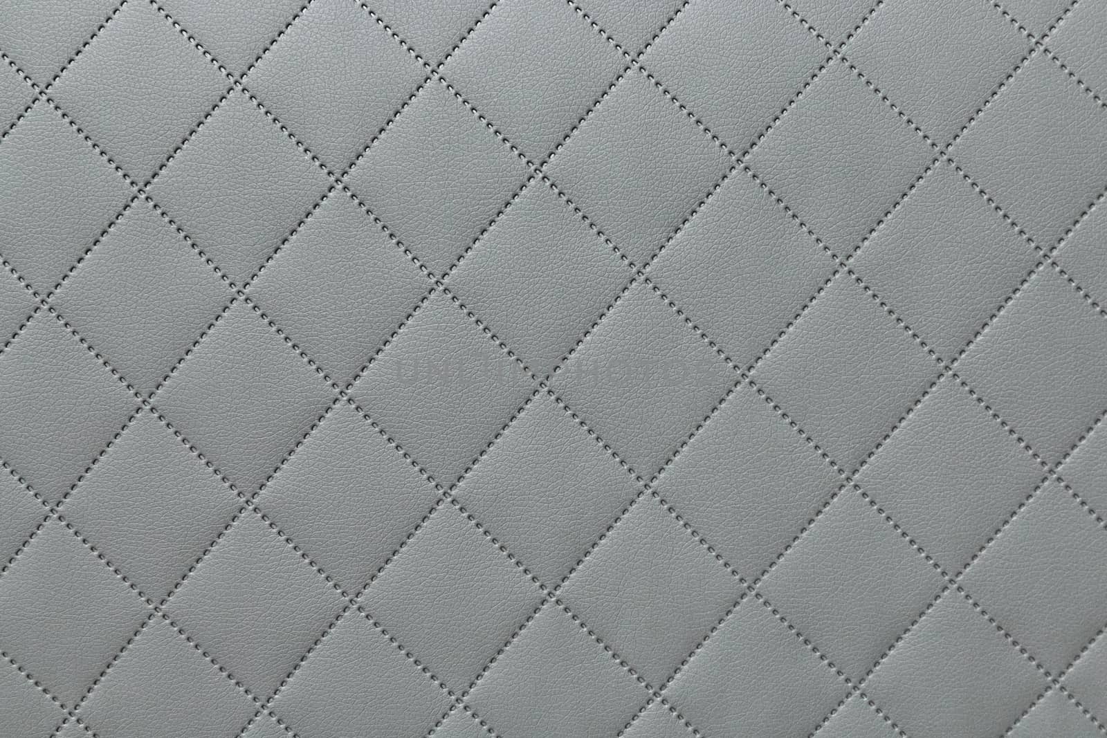 detail of sewn leather, gray leather upholstery background pattern