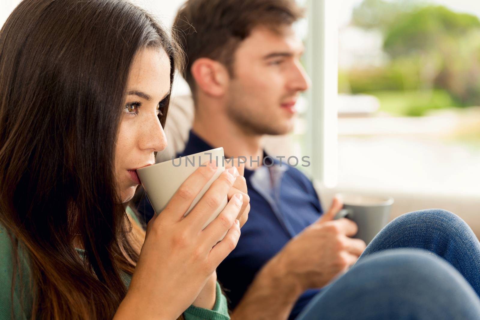 Young couple drinking coffee by Iko