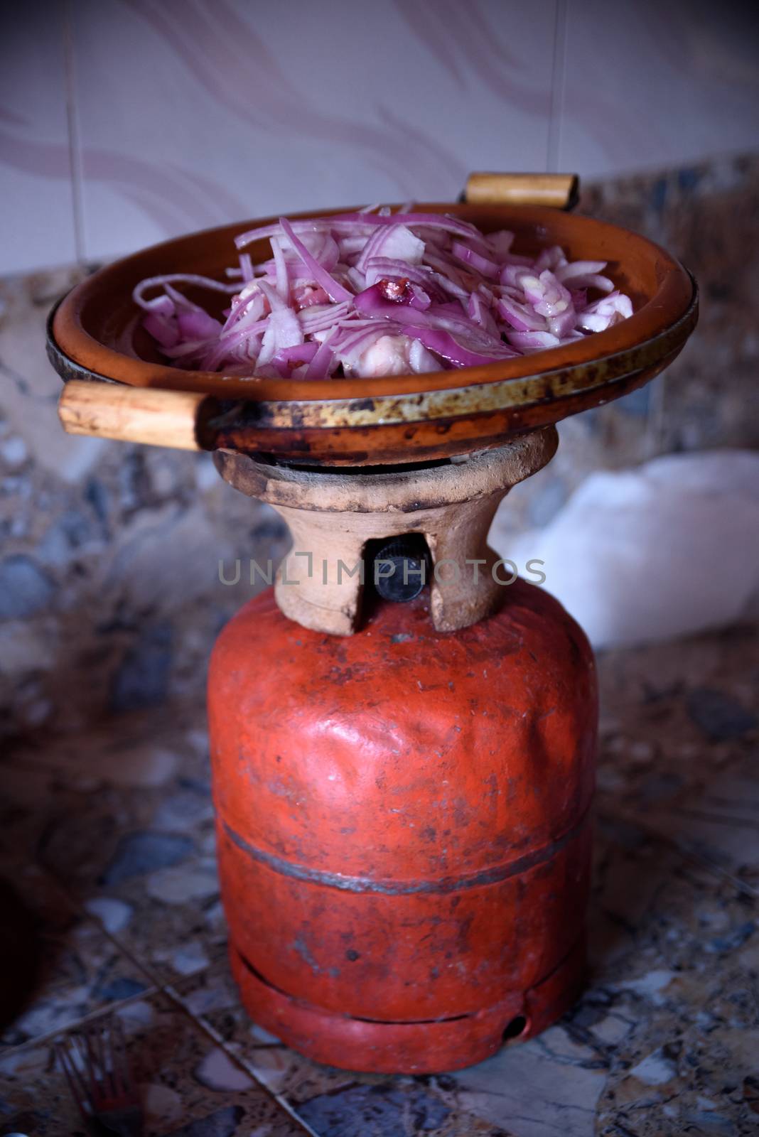 Traditional moroccan tajine making on gas bottle in the village