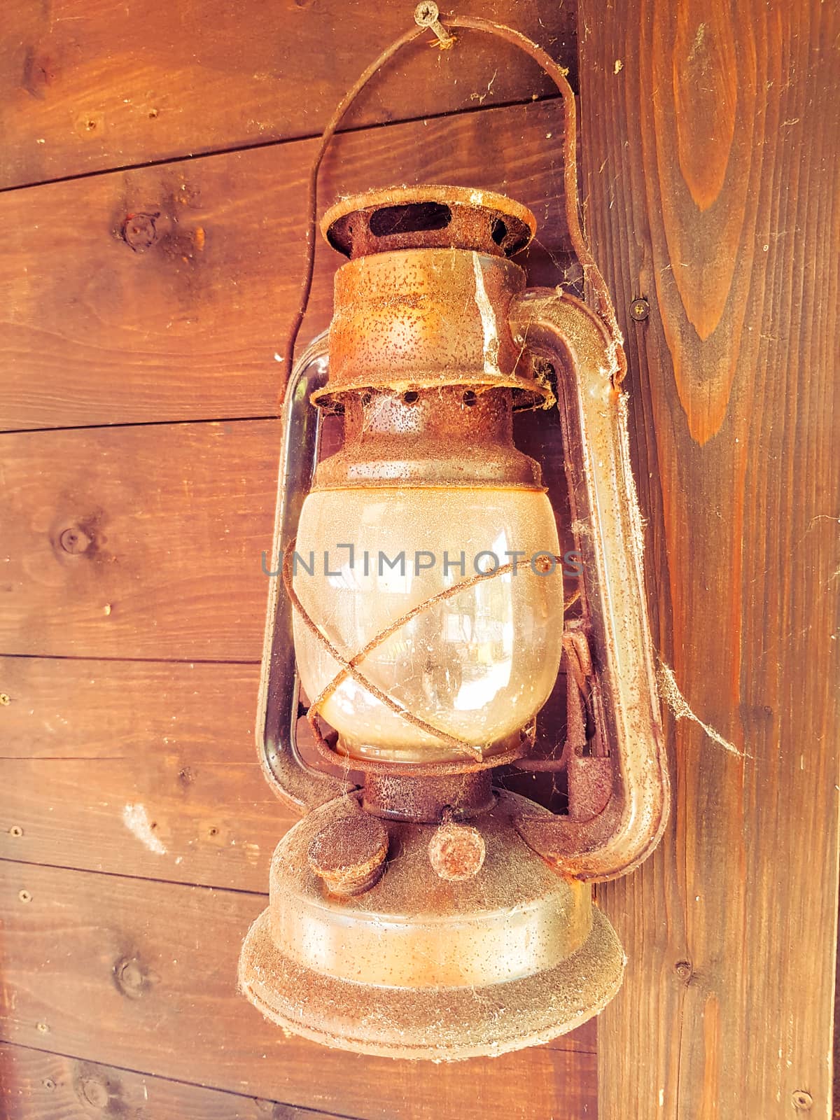 Old Lantern On Wooden Wall by gstalker