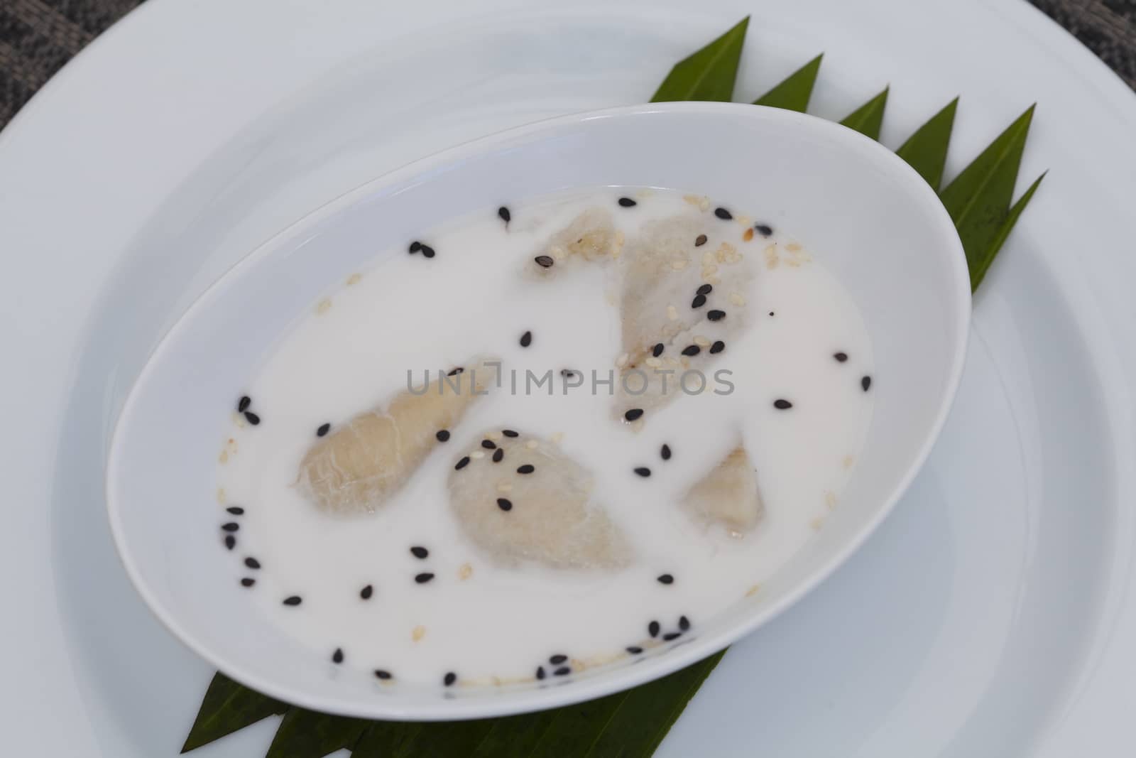 Banana Cooked in Coconut Milk (Kluay Buat Chi)Thai desserts made from banana and coconut milk.Sweet taste it mellow.