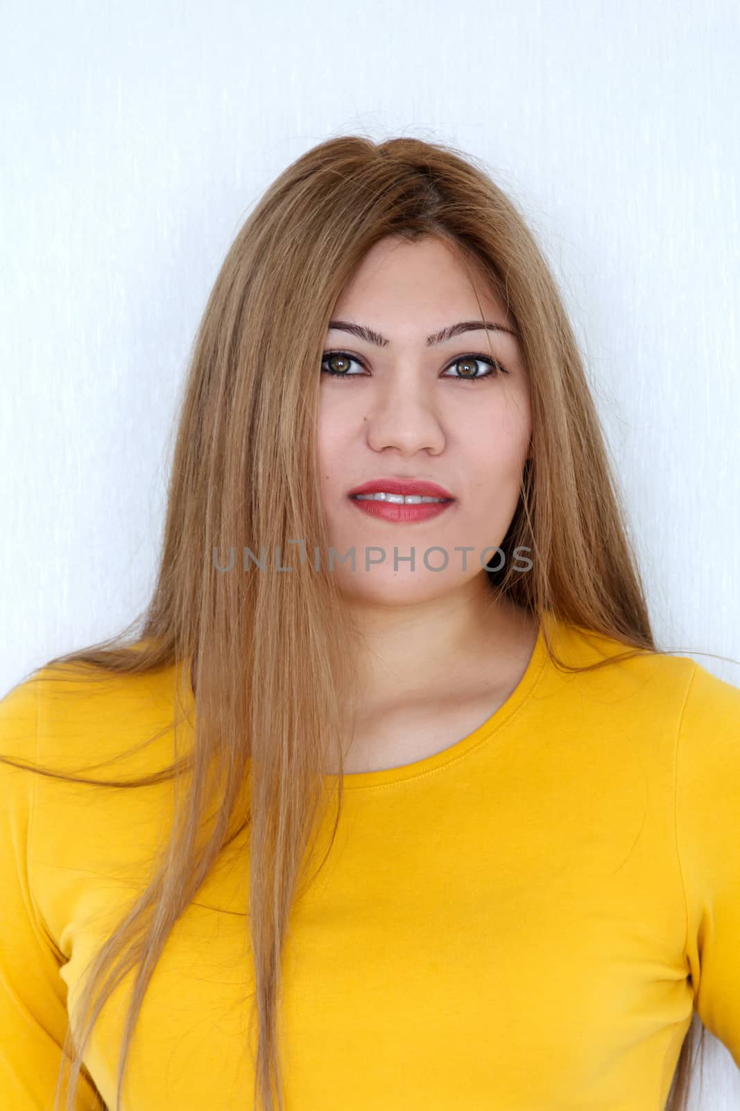 Vertical Attractive young girl with long brown healthy straight hair