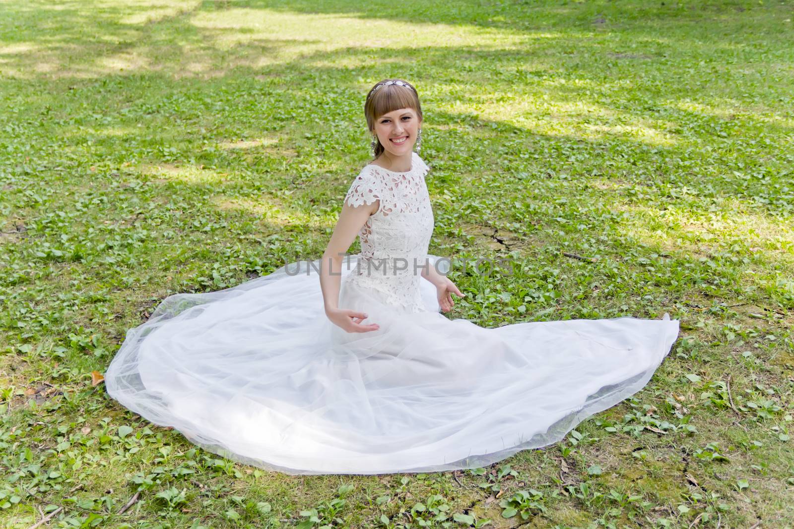 Beautiful bride in white lace dress of summer time by Julialine