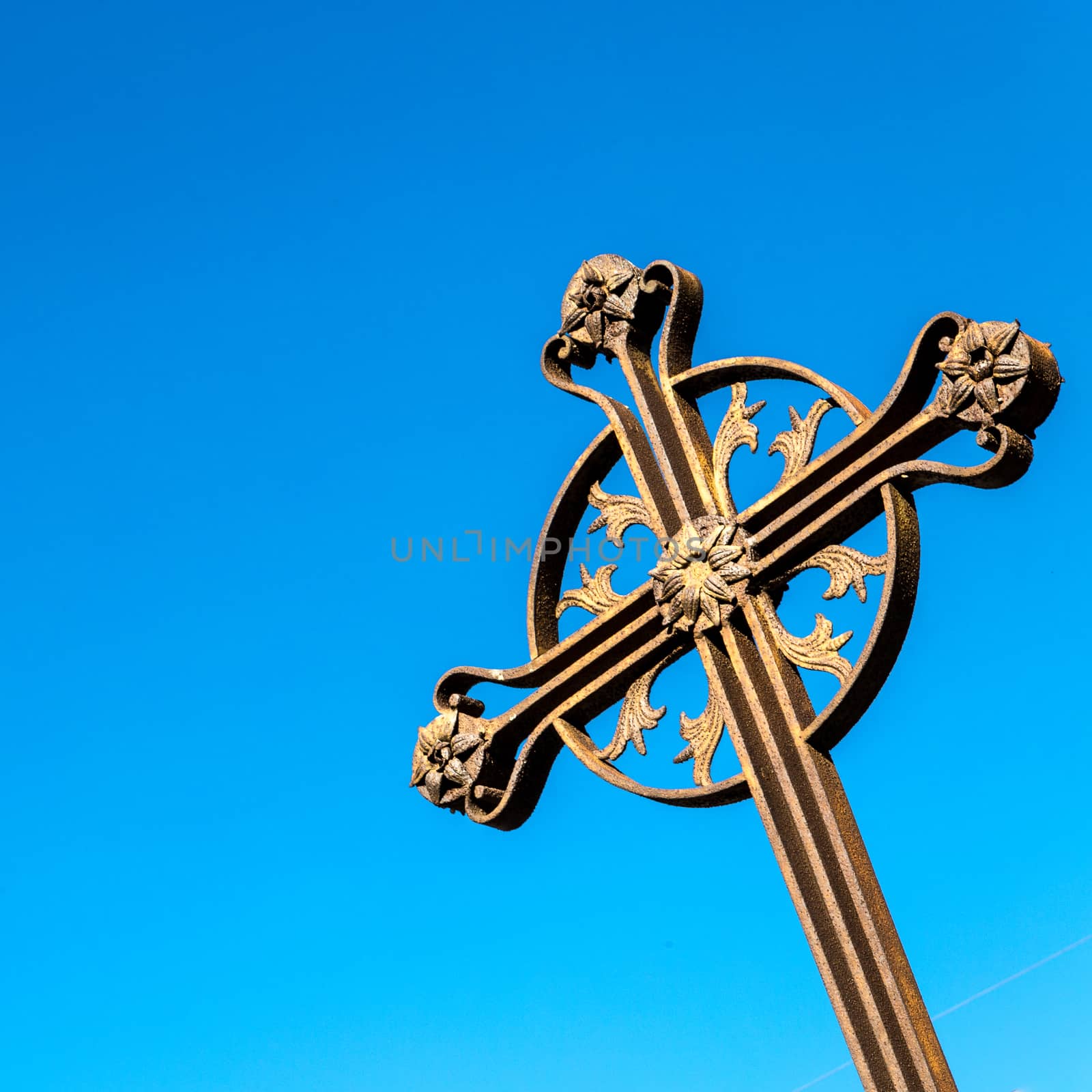 An ancient iron cross on the sky