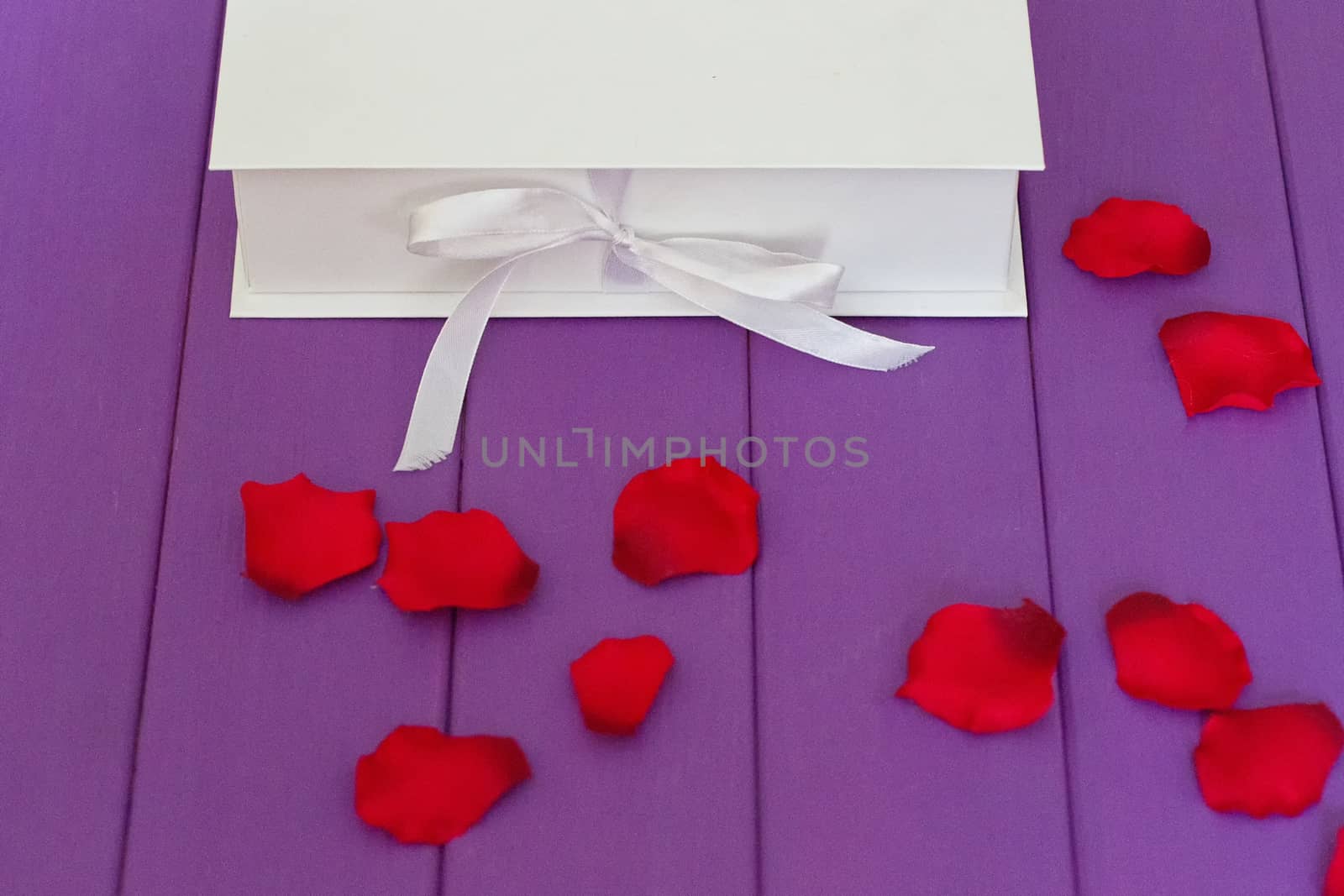 Rose petals and gift box by victosha