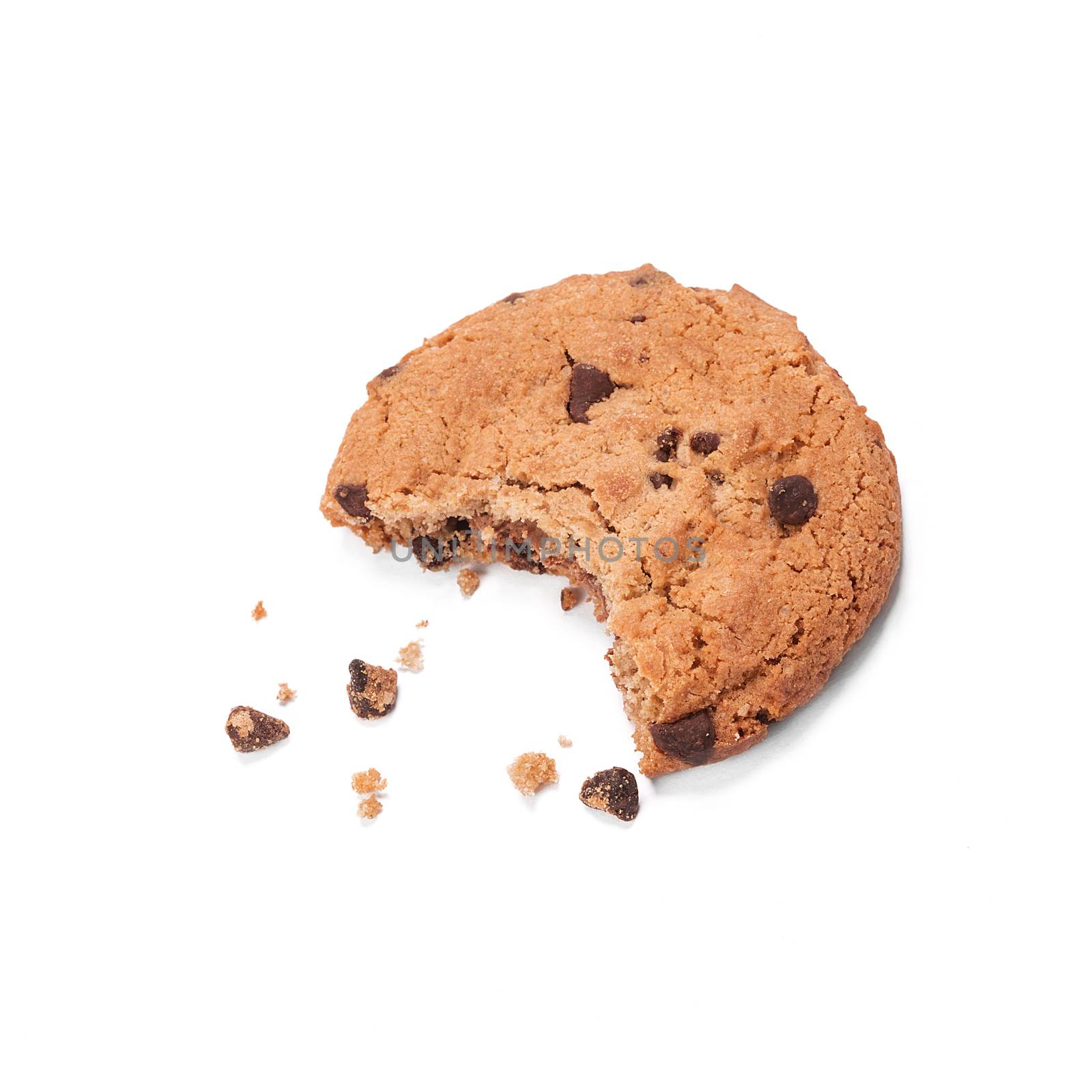 Single round chocolate chip biscuit with crumbs and bite missing, isolated on white from above. Sweet biscuits. Homemade pastry. Chocolate chip cookie.