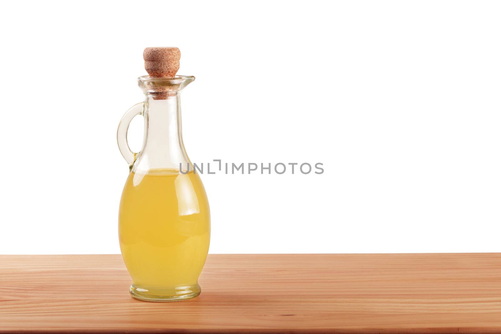 Apple cider vinegar and fresh apple on wooden background