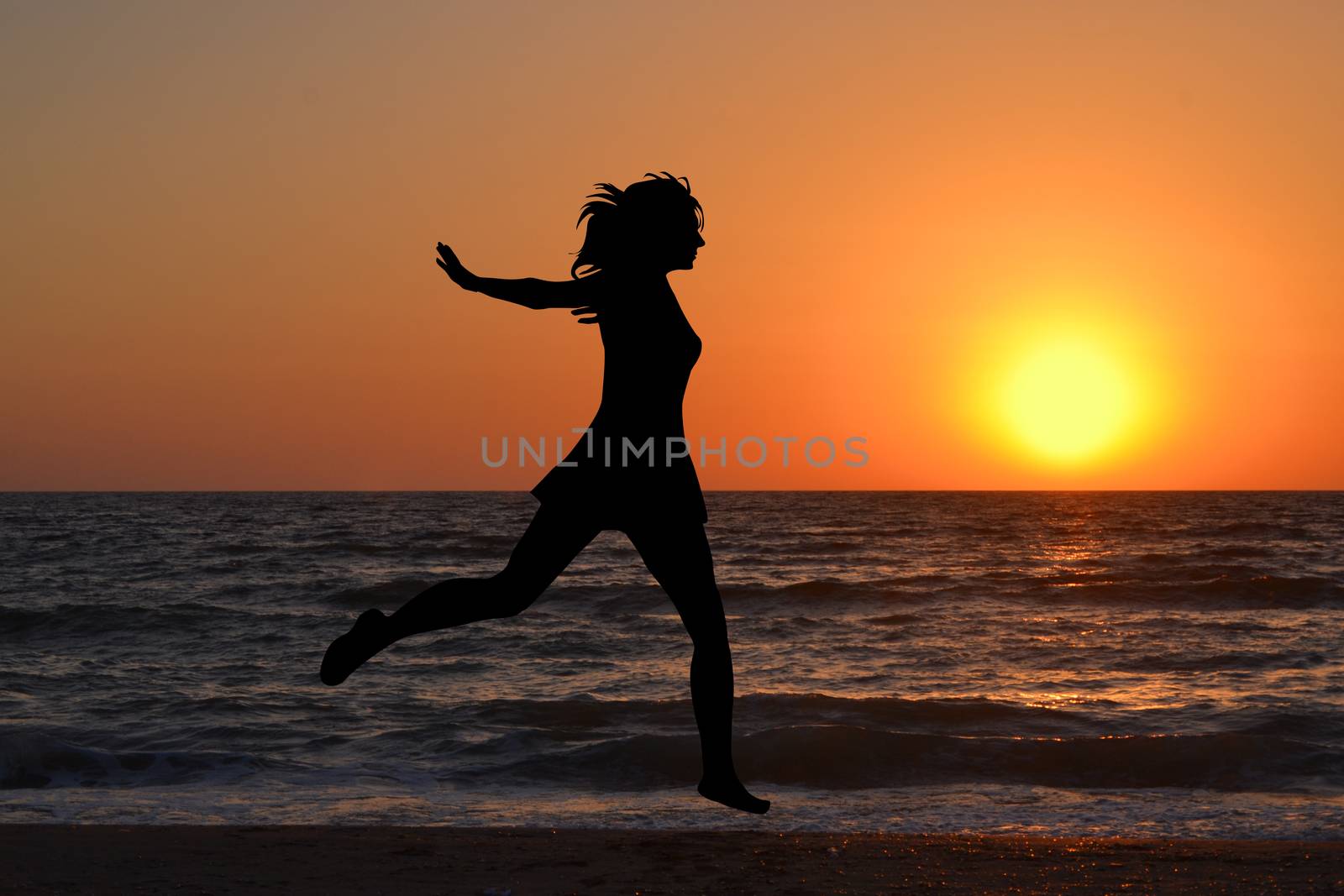 Happy woman jumping in sea sunrise