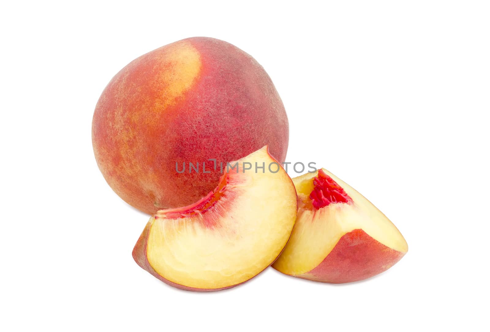 One whole ripe fresh peach and two peach slices on a white background
