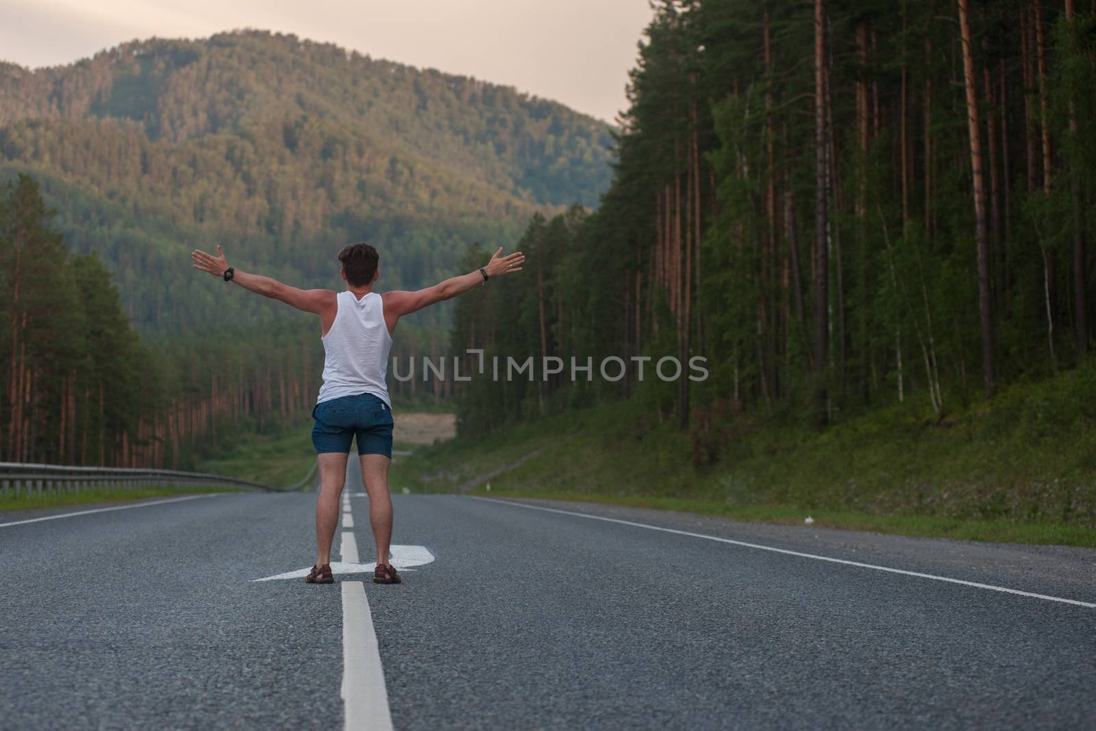 Man laying on the road by rusak