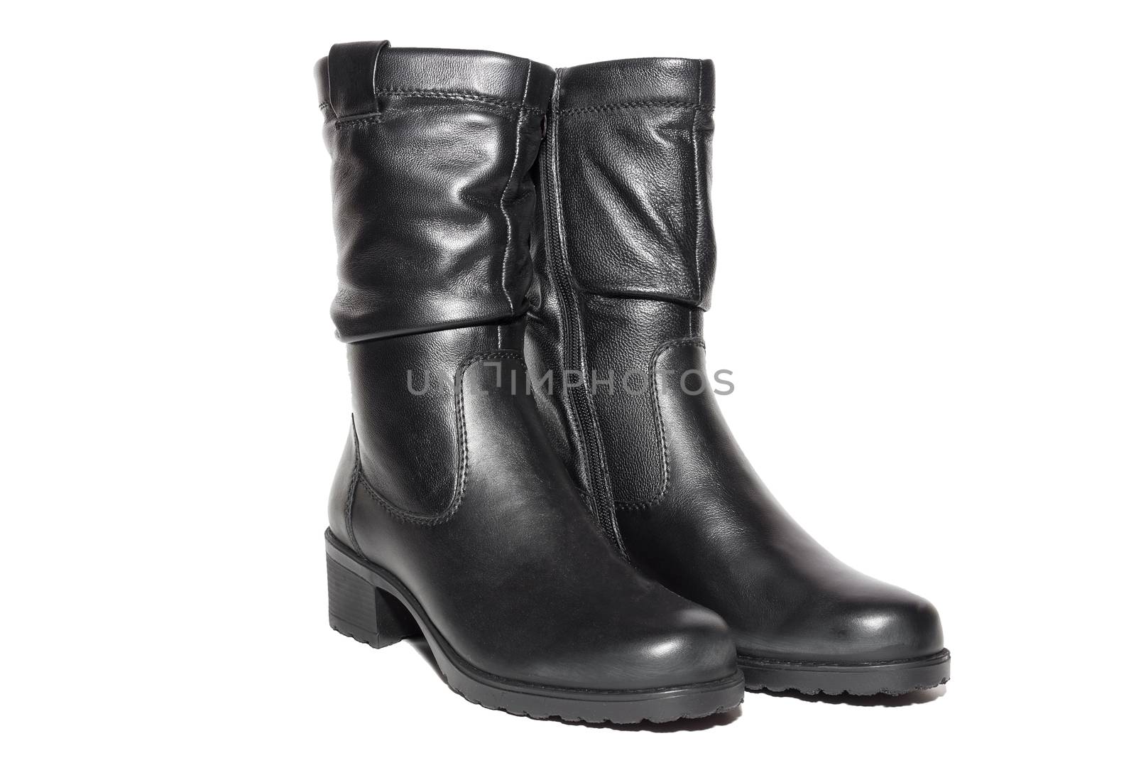 Women's leather black boots on white background, isolated, studio