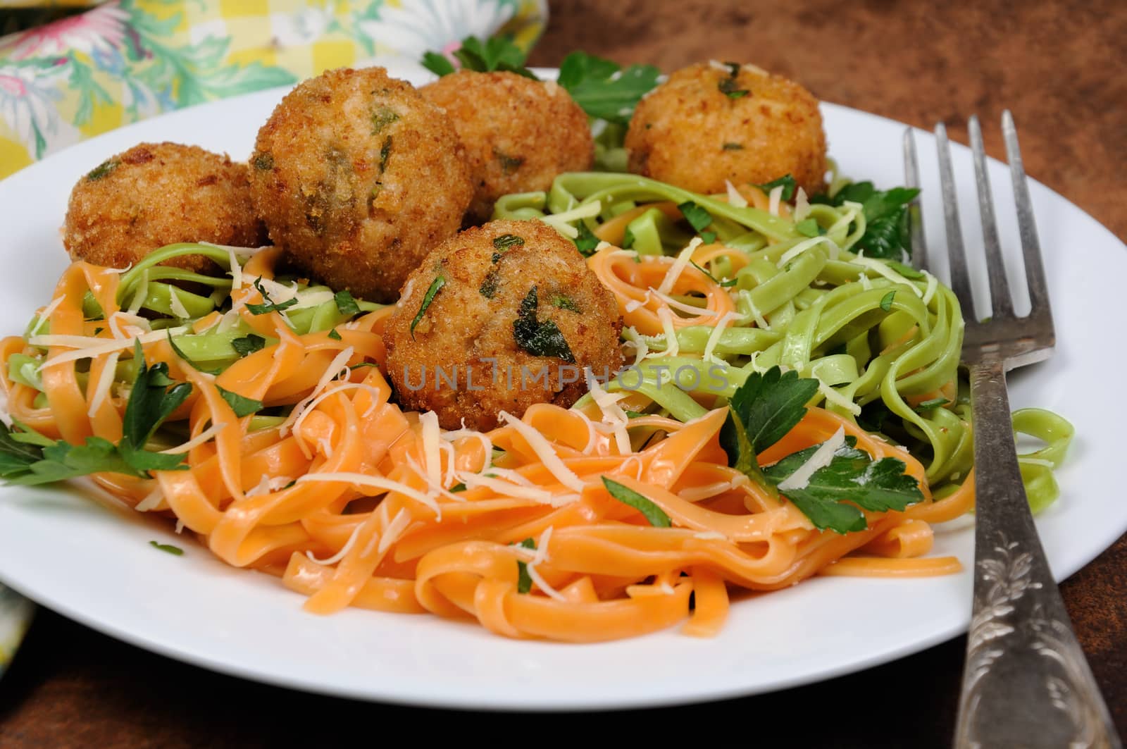 Spaghetti from carrots and spinach with chicken meatballs flavored cheese parmesan, herb